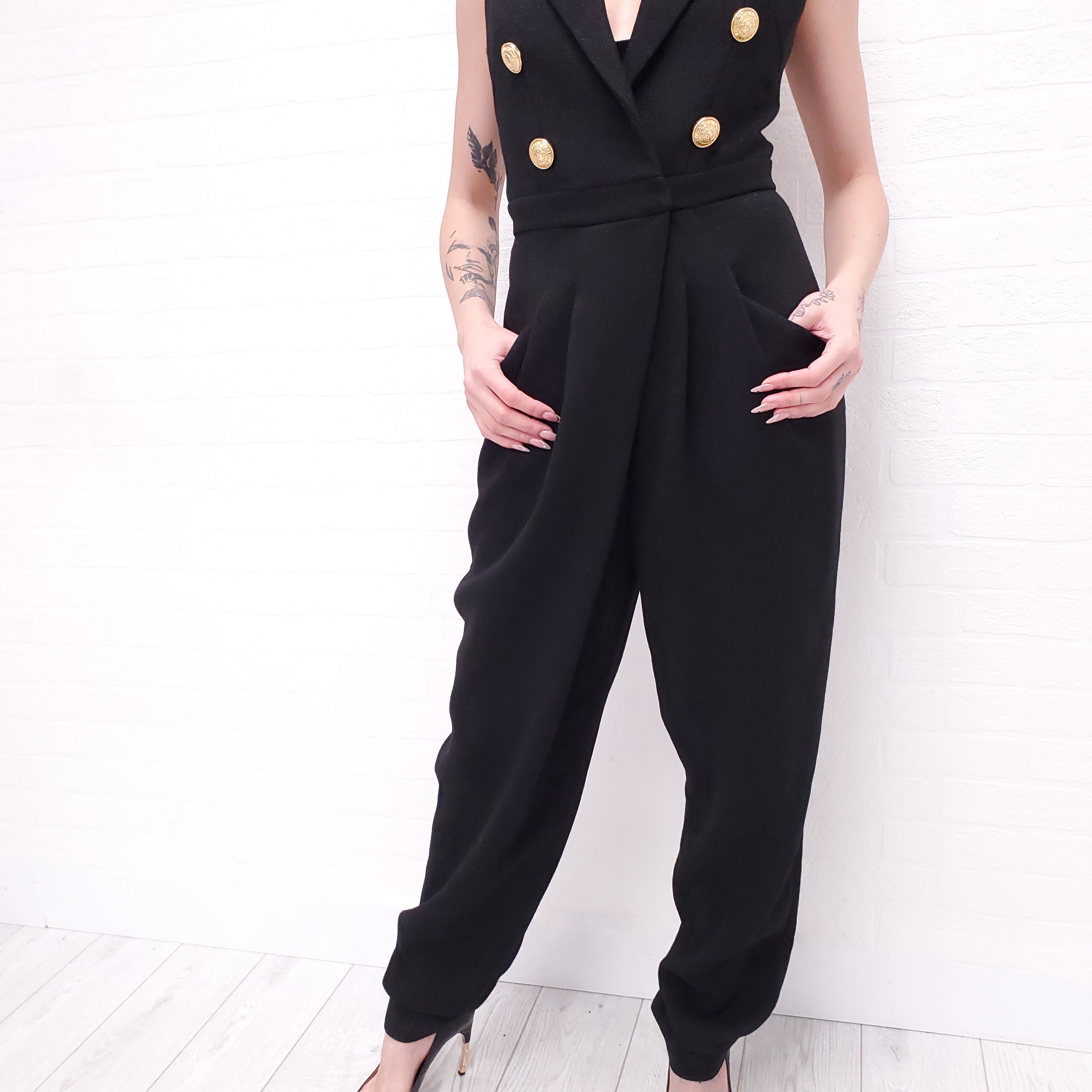 BALMAIN BLACK JUMPSUIT WITH LAPELS AND GOLD LOGO BUTTONS - SIZE XS
