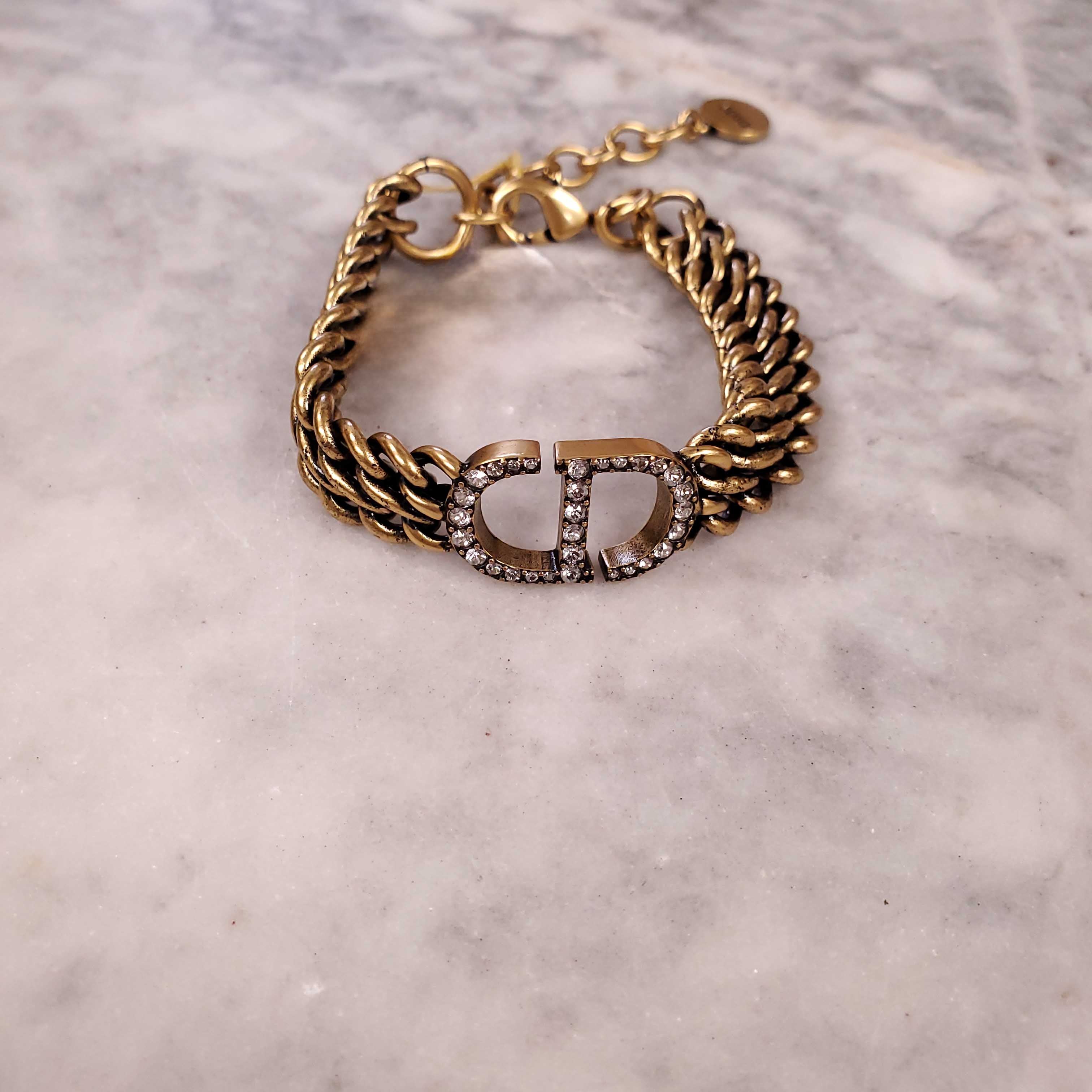 CHRISTIAN DIOR GOLD BRACELET AND EARRINGS SET WITH DIAMANTE CD DETAIL