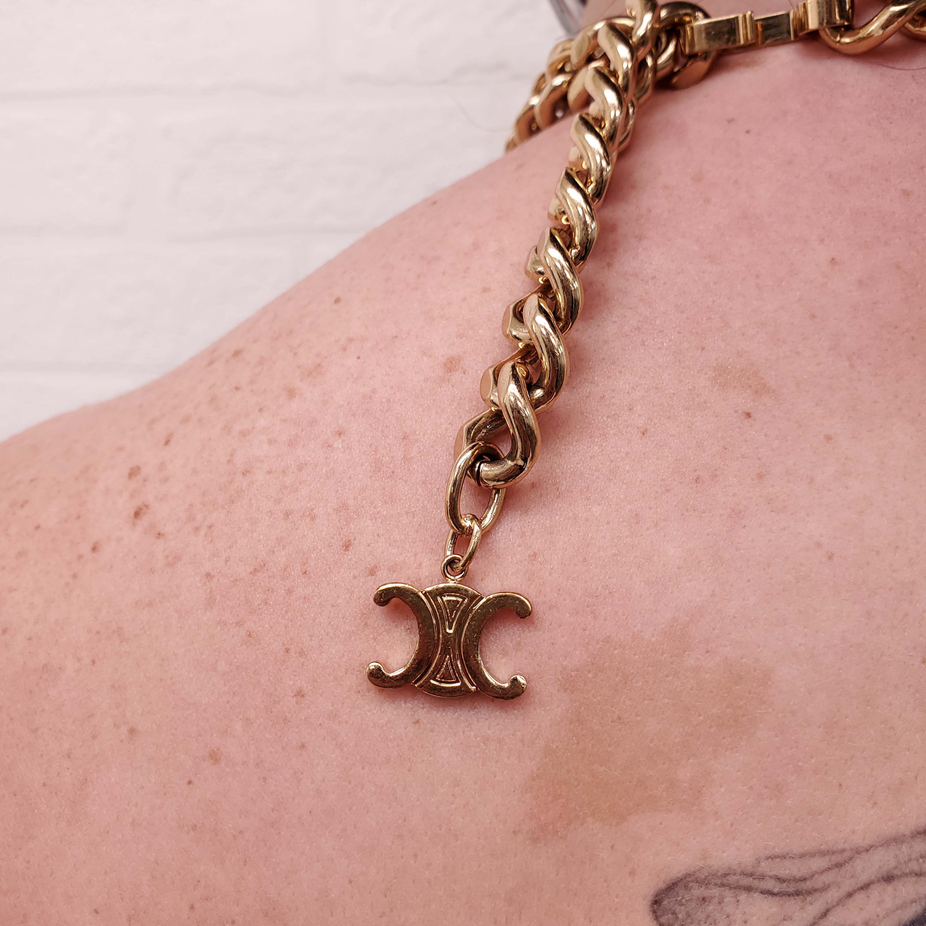 CELINE BLACK JUMPSUIT WITH GOLD CHAIN DETAIL - SIZE 36