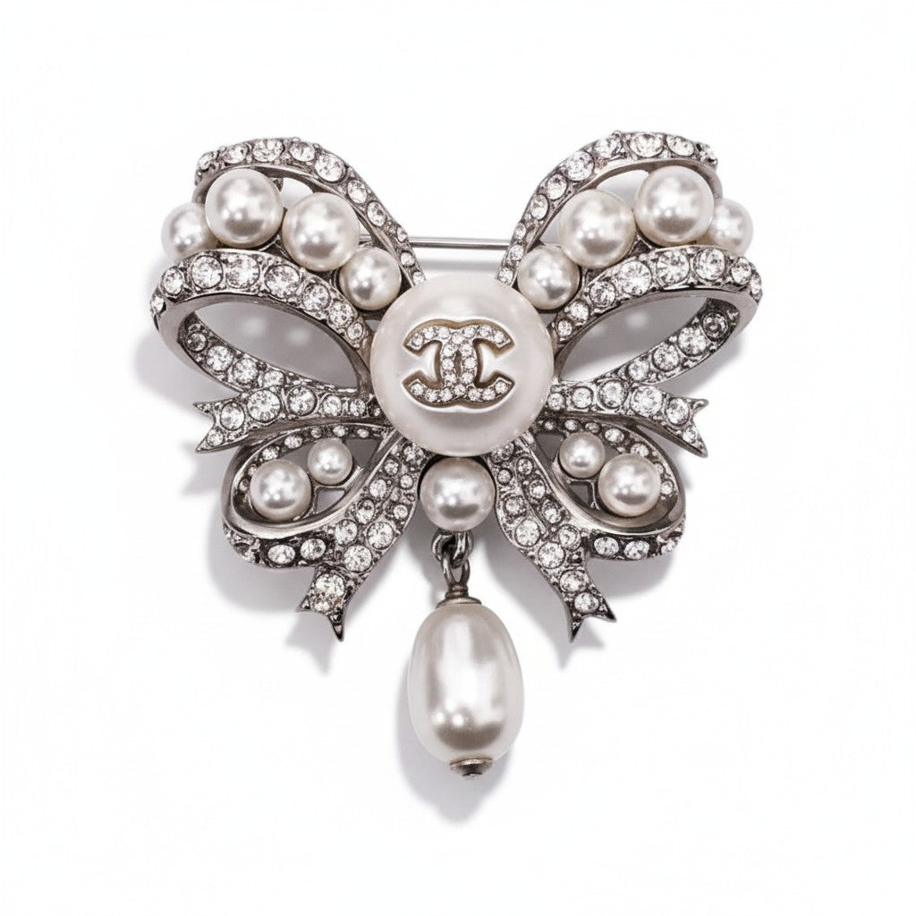 CHANEL CRYSTAL AND PEARL BOW BROOCH
