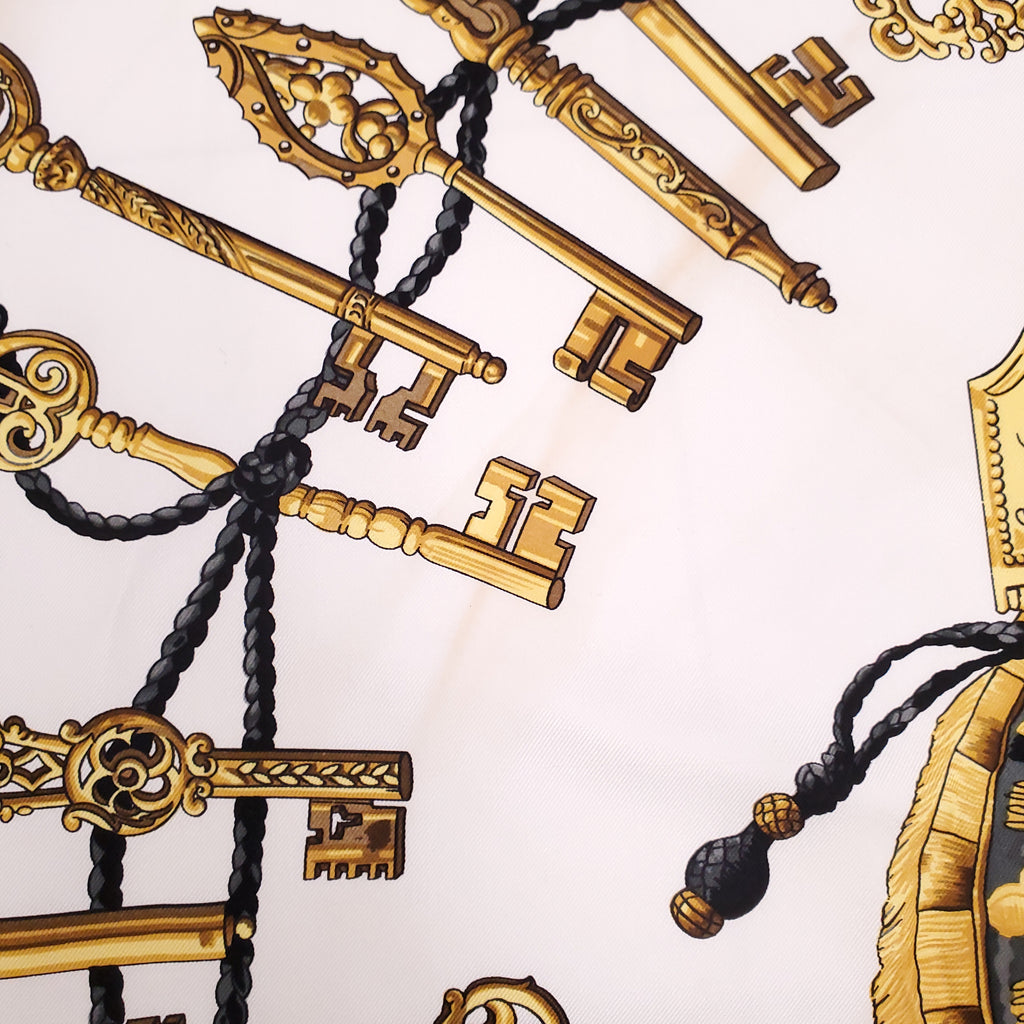 HERMÈS CREAM AND BLACK KEY PATTERNED SILK SCARF