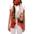 VERSACE BLACK AND GOLD PATTERNED SCARF WITH ORANGE TRIM