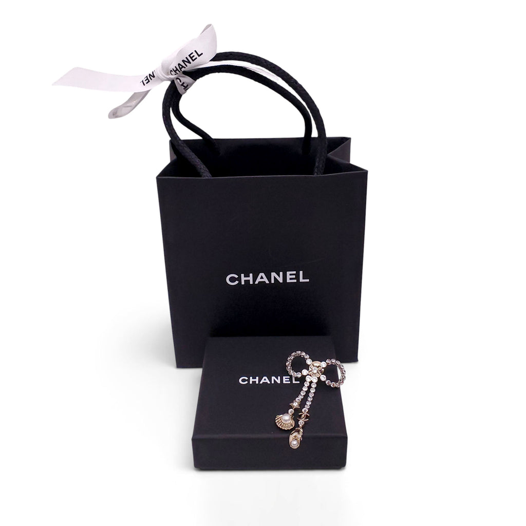 CHANEL CRYSTAL BOW BROOCH WITH SEASHELL AND LOBSTER CLAW