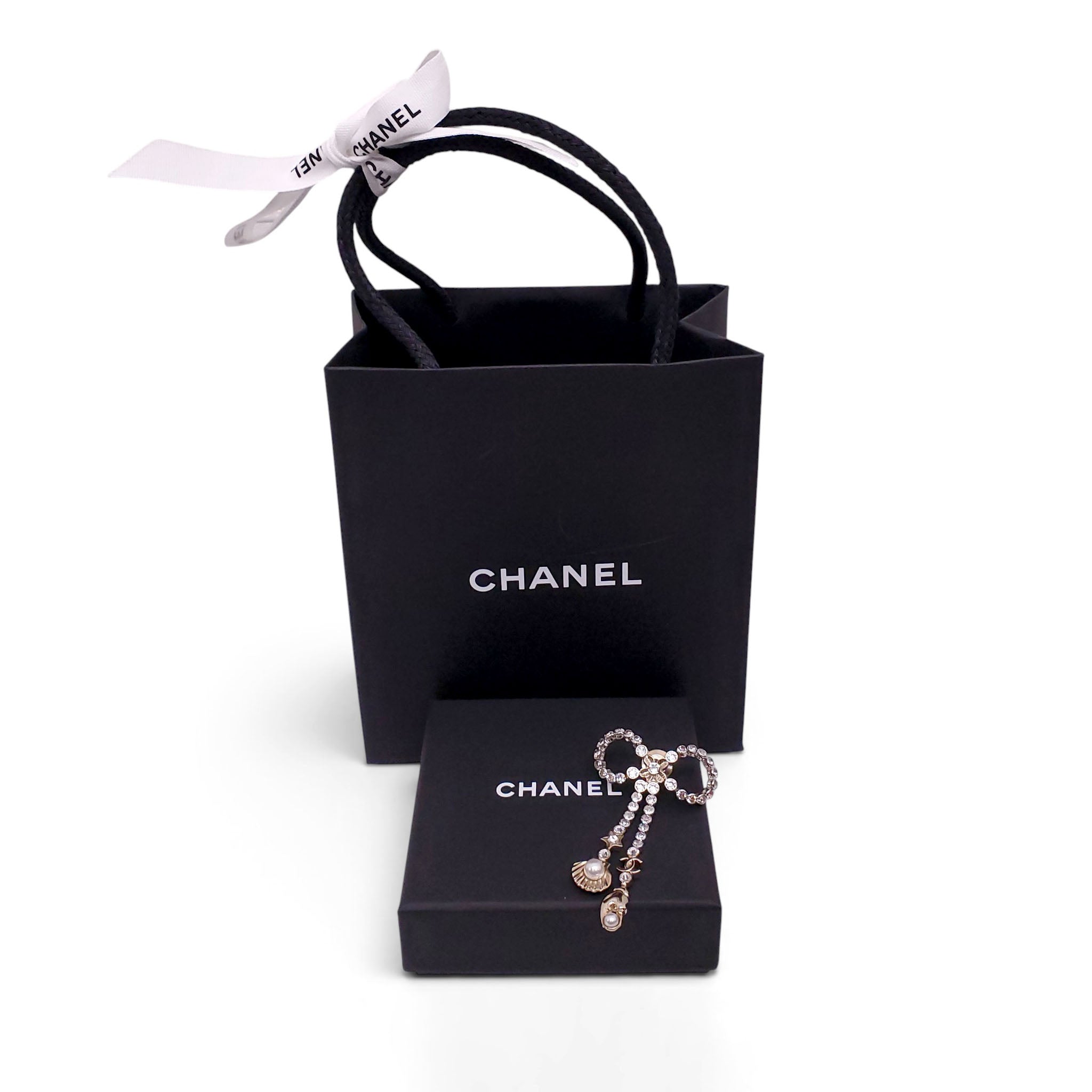 CHANEL CRYSTAL BOW BROOCH WITH SEASHELL AND LOBSTER CLAW