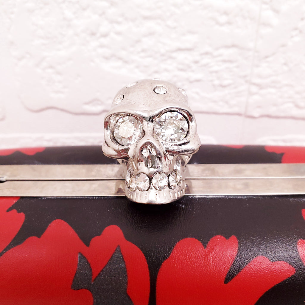 ALEXANDER MCQUEEN RED AND BLACK PATTERNED SKULLS CLUTCH