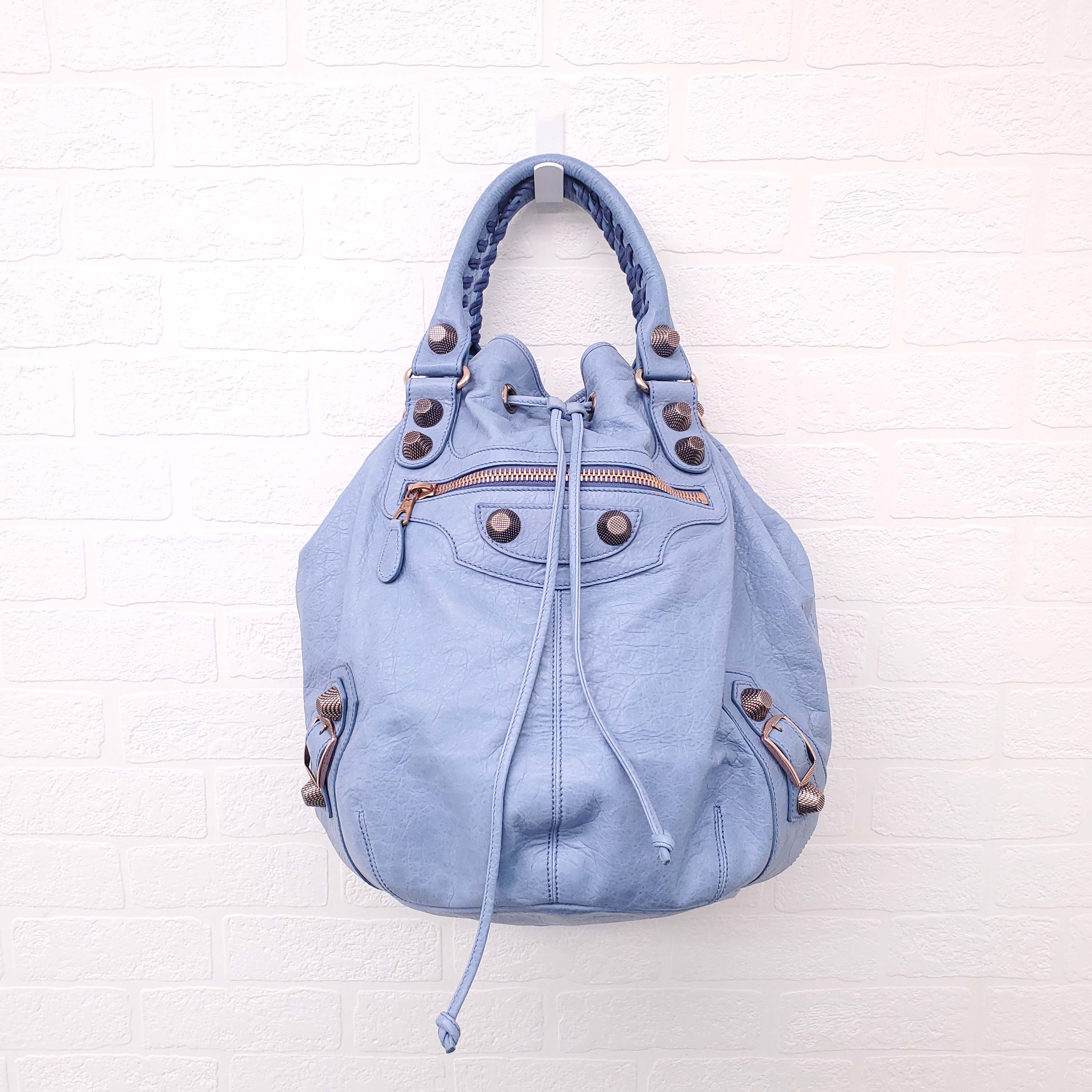 BALENCIAGA BLUE GIANT 'MOTOCROSS CITY' BUCKET BAG WITH ROSE GOLD GROMMETS