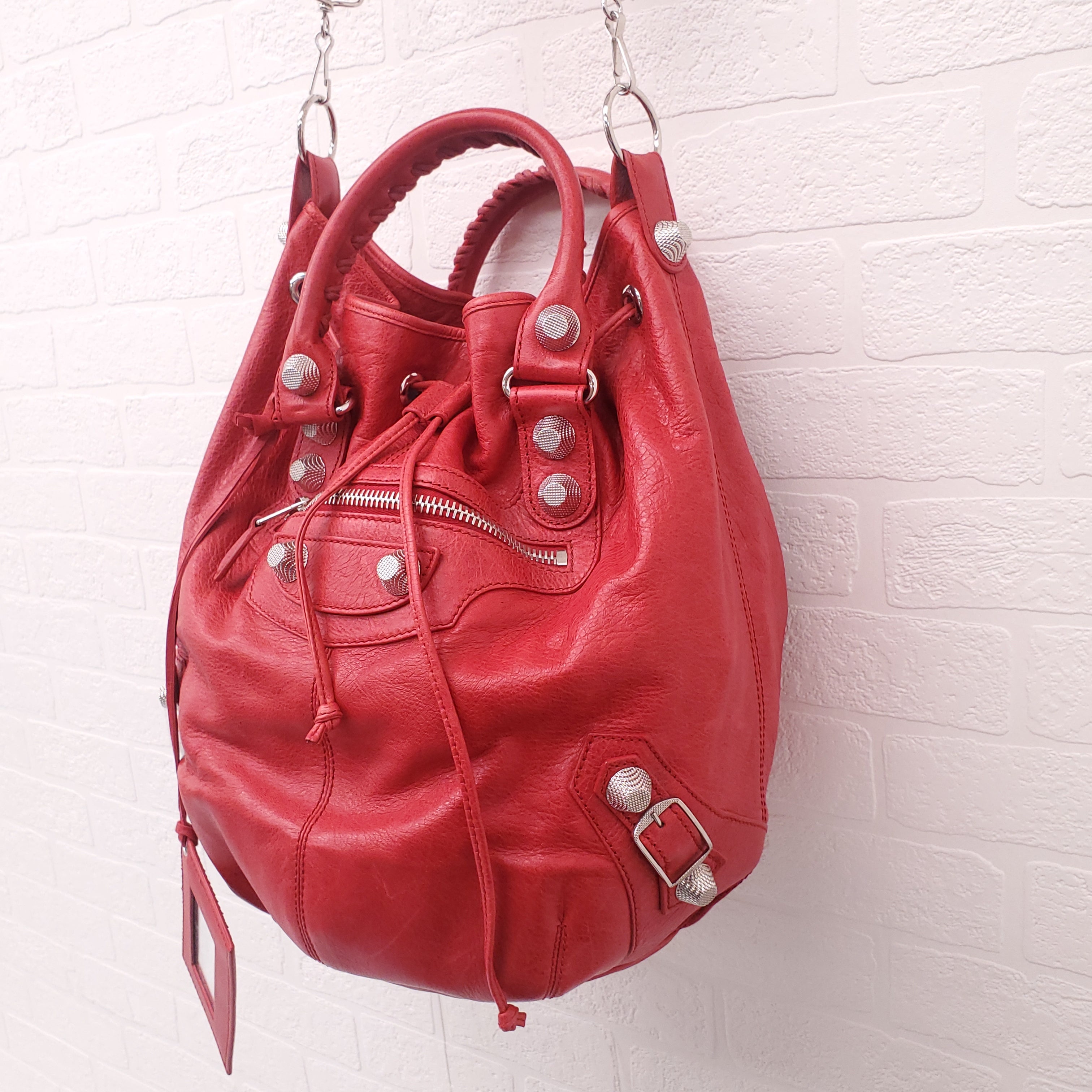 BALENCIAGA RED GIANT 'MOTOCROSS CITY' BUCKET BAG WITH SILVER GROMMETS