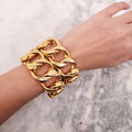 CHANEL 1986 GOLD-TONED CUFF BRACELET RESEMBLING A CHAIN