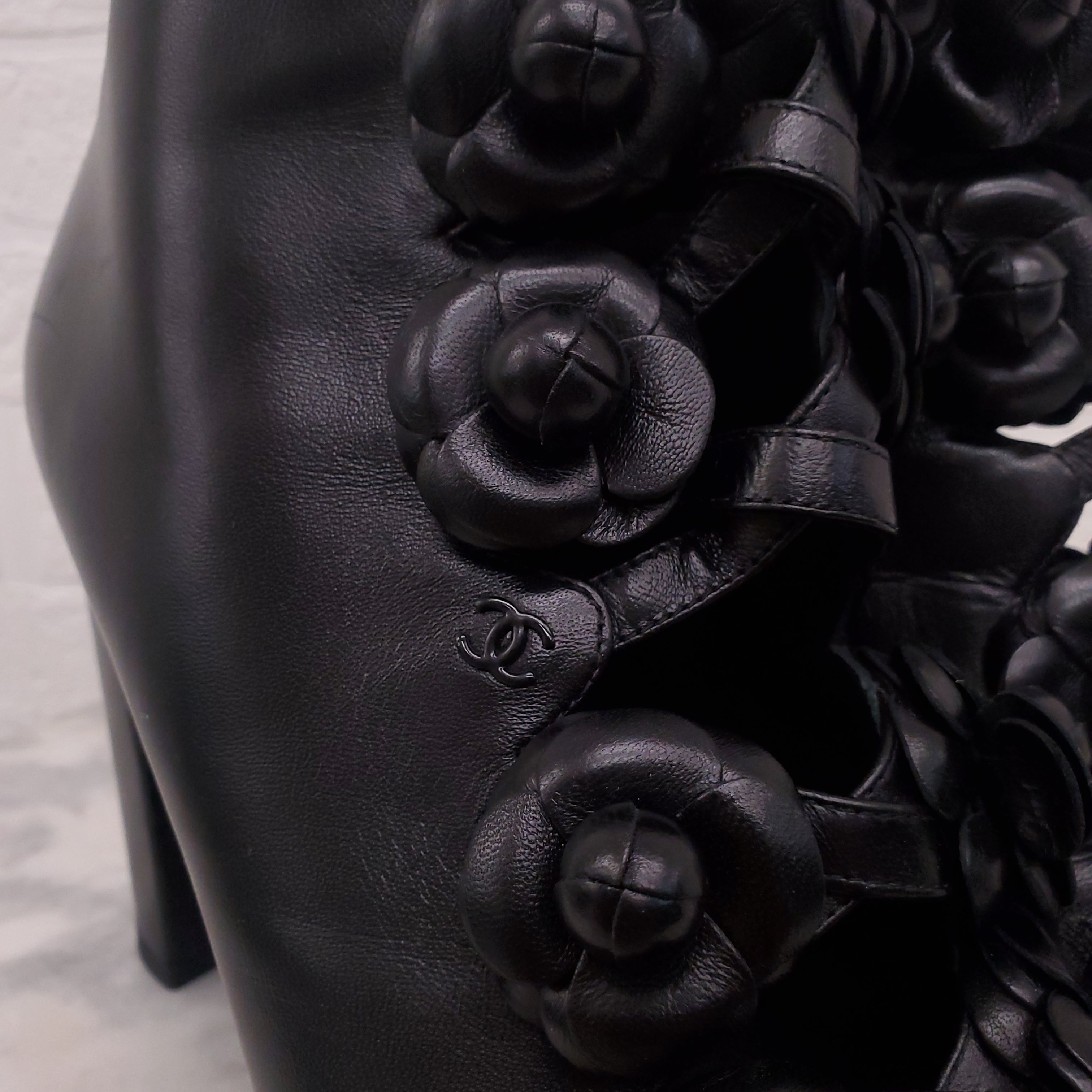 CHANEL BLACK LEATHER CAMELIA BOOTIES - SIZE 39
