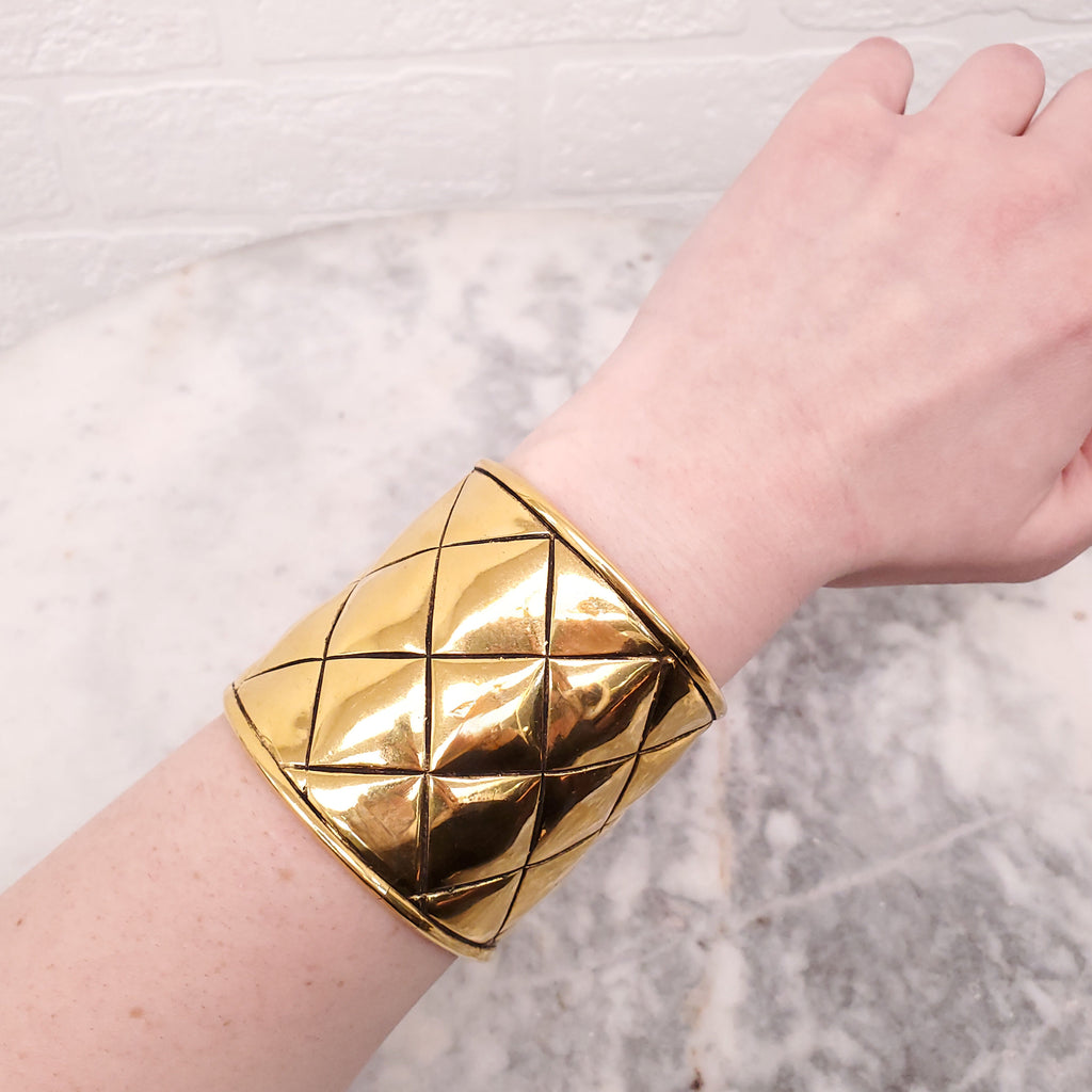 CHANEL CUFF WITH GOLD-TONED METAL AND QUILTED PATTERN