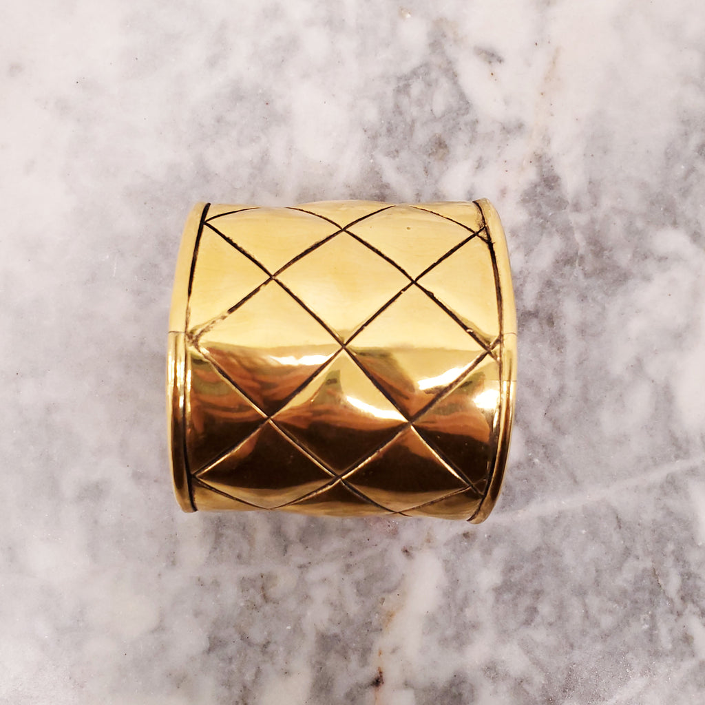 CHANEL CUFF WITH GOLD-TONED METAL AND QUILTED PATTERN