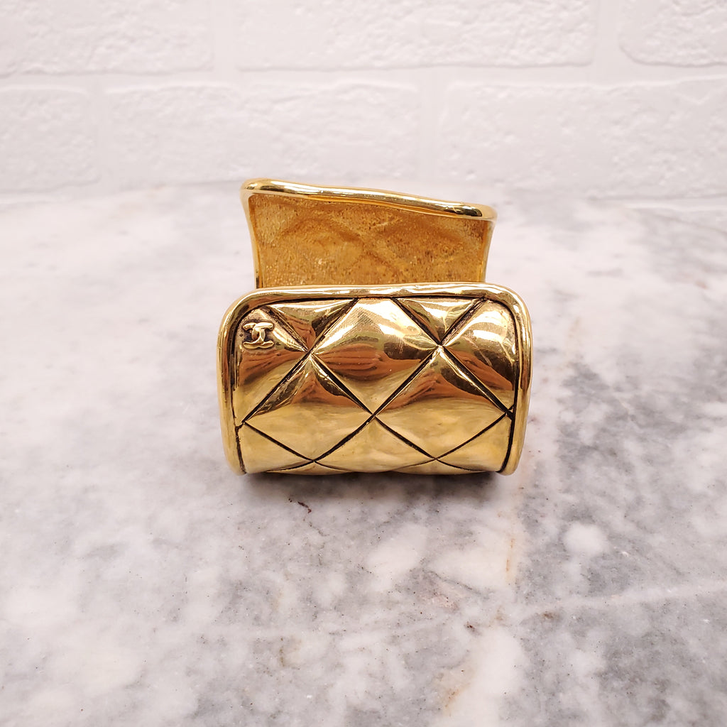 CHANEL CUFF WITH GOLD-TONED METAL AND QUILTED PATTERN