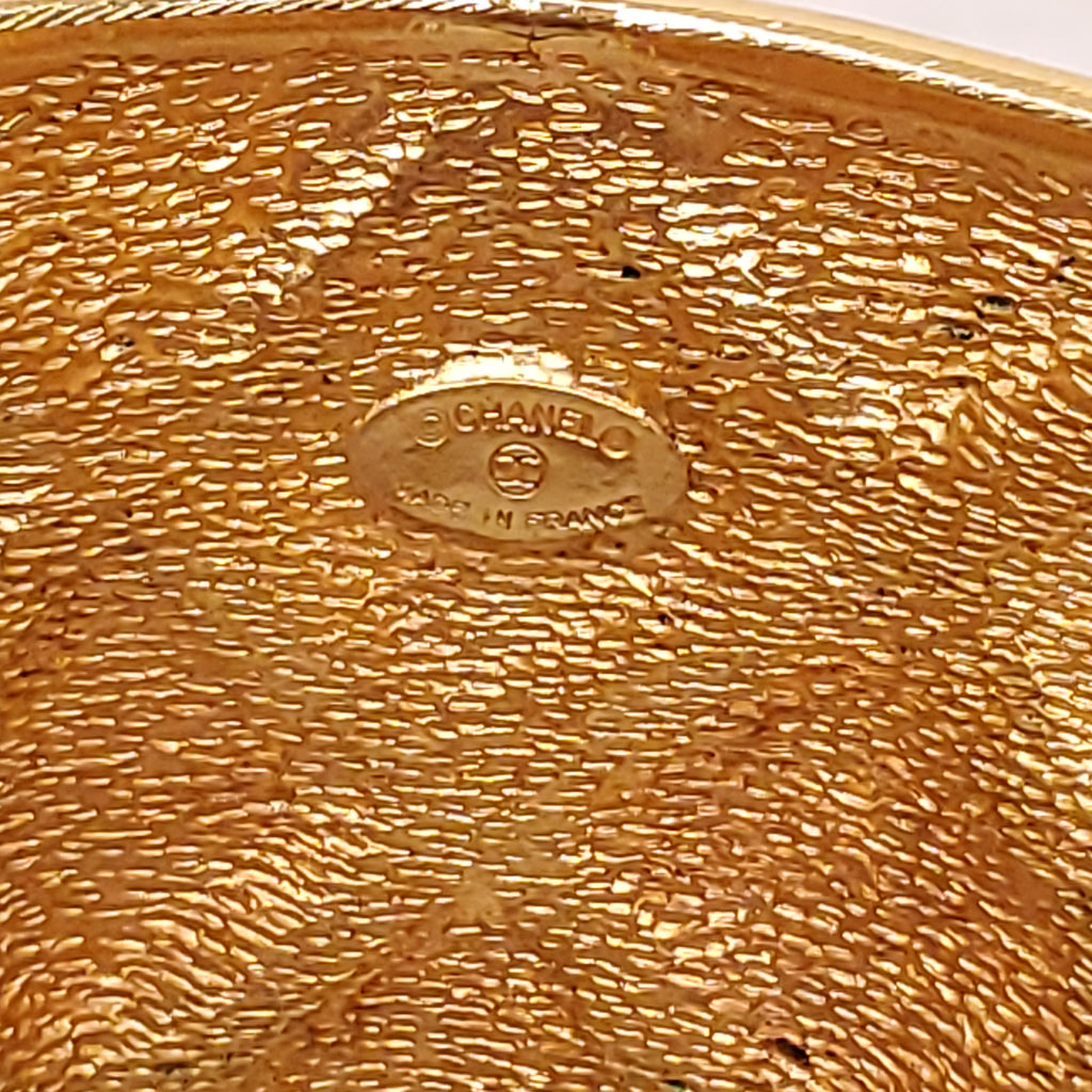 CHANEL CUFF WITH GOLD-TONED METAL AND QUILTED PATTERN