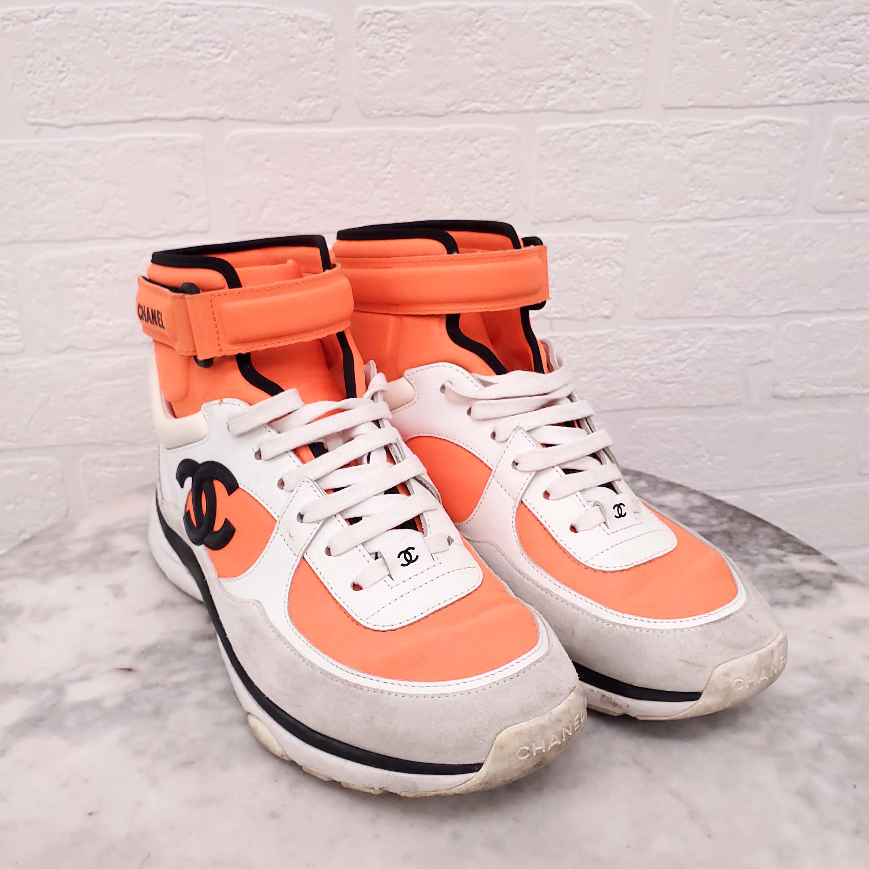CHANEL NEON ORANGE HIGH TOP LOGO SNEAKERS - SIZE 39.5