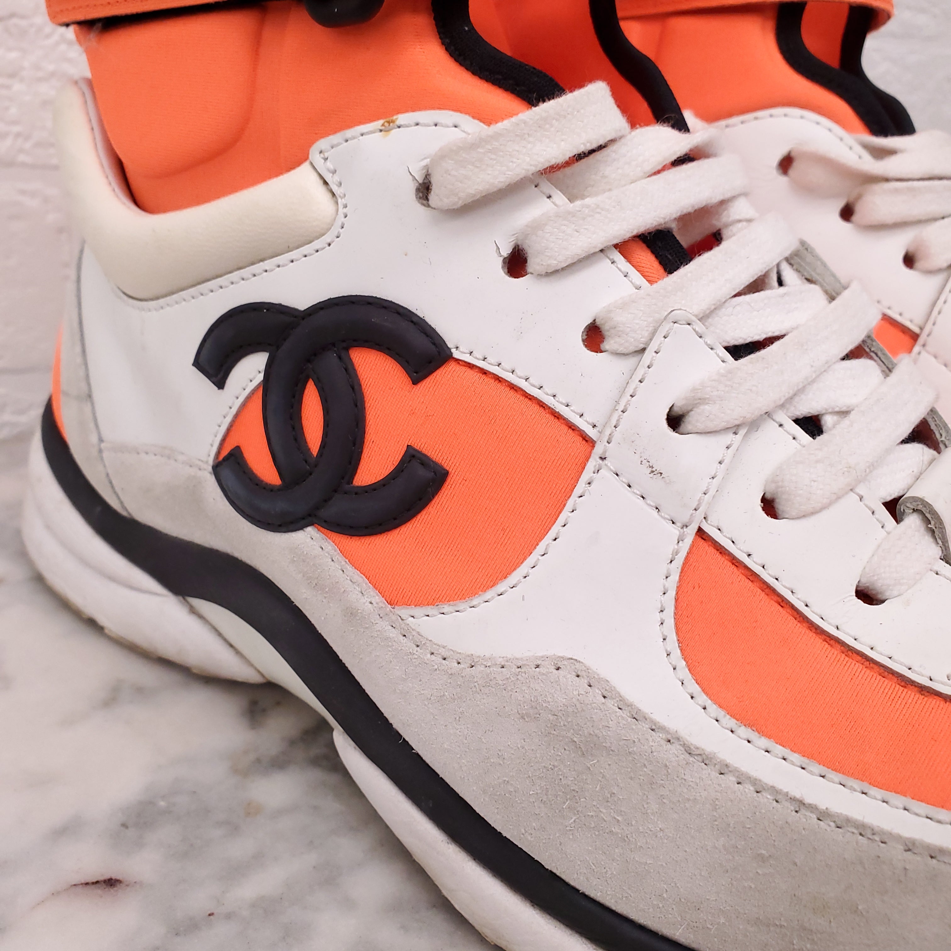 CHANEL NEON ORANGE HIGH TOP LOGO SNEAKERS - SIZE 39.5