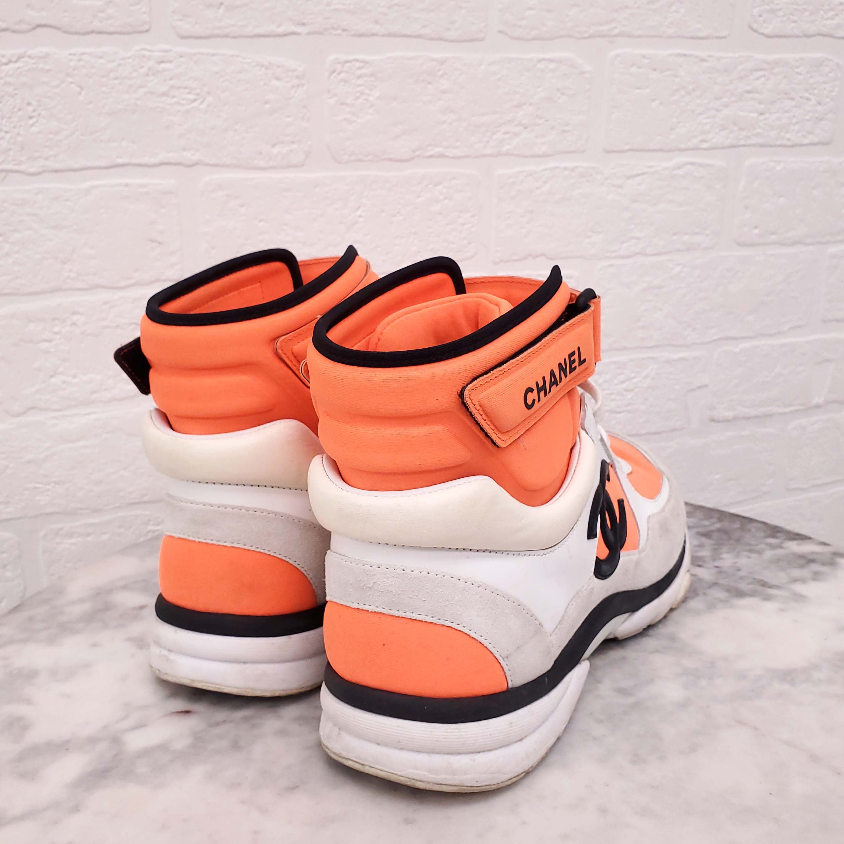 CHANEL NEON ORANGE HIGH TOP LOGO SNEAKERS - SIZE 39.5