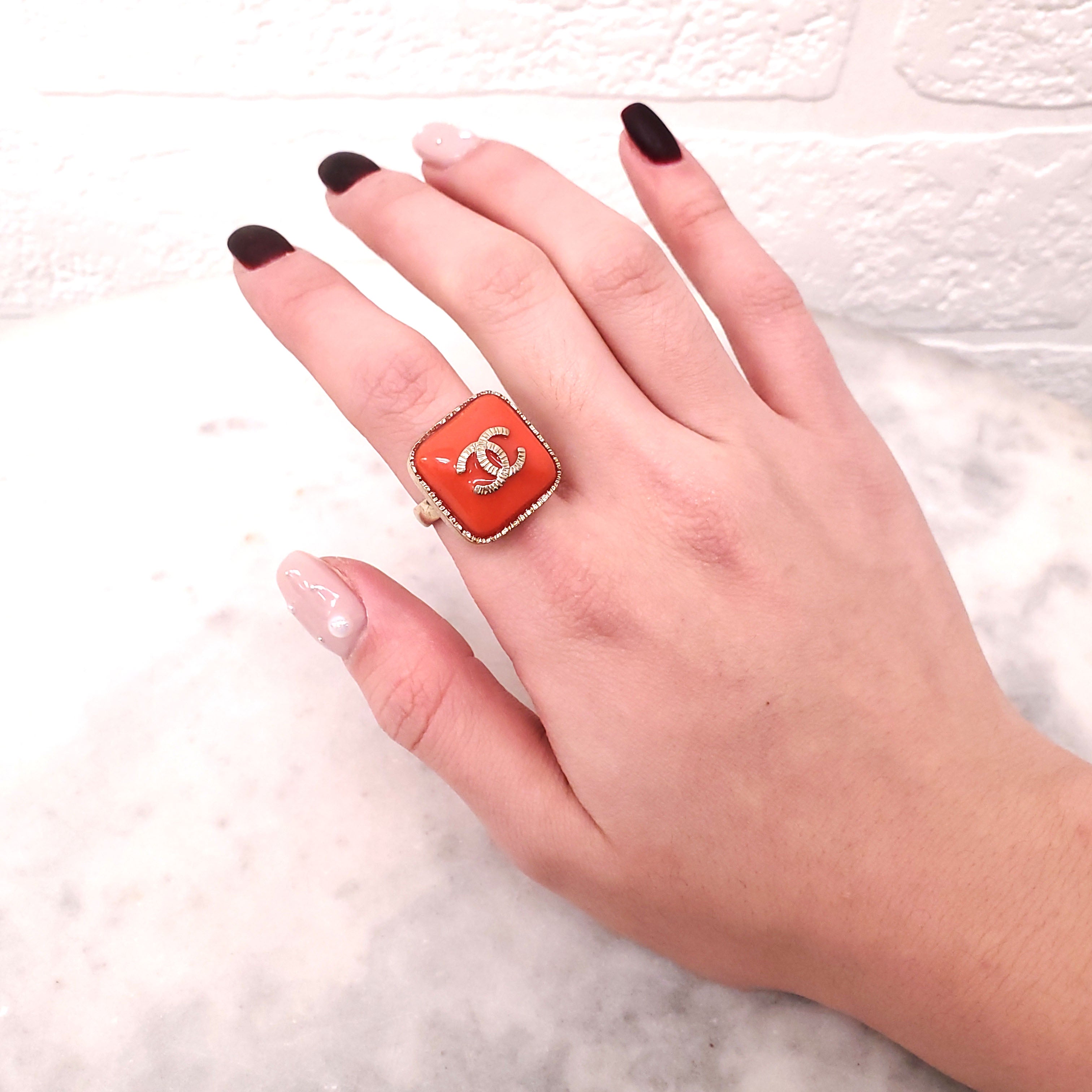 CHANEL ORANGE LOGO RING - SIZE 5