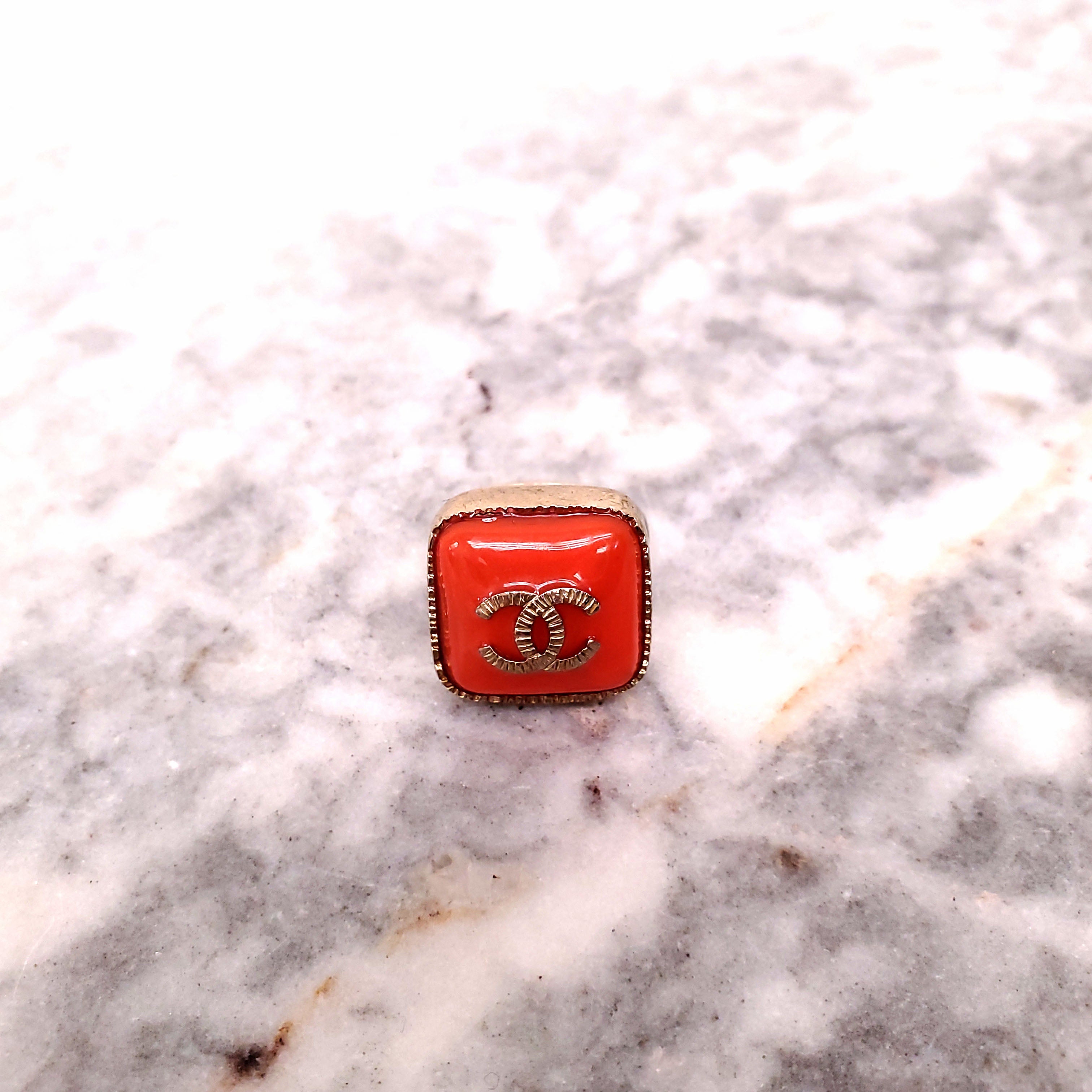CHANEL ORANGE LOGO RING - SIZE 5