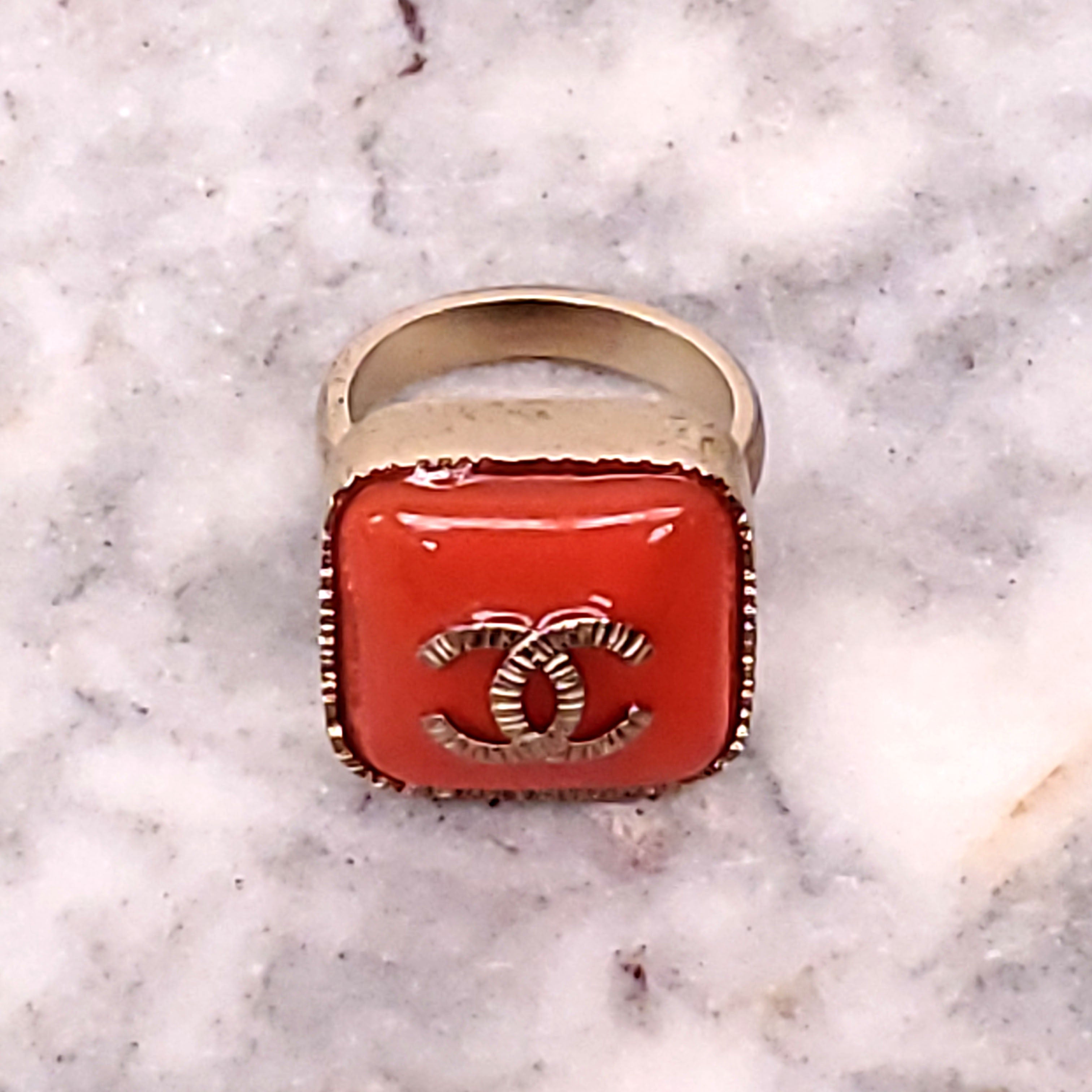 CHANEL ORANGE LOGO RING - SIZE 5