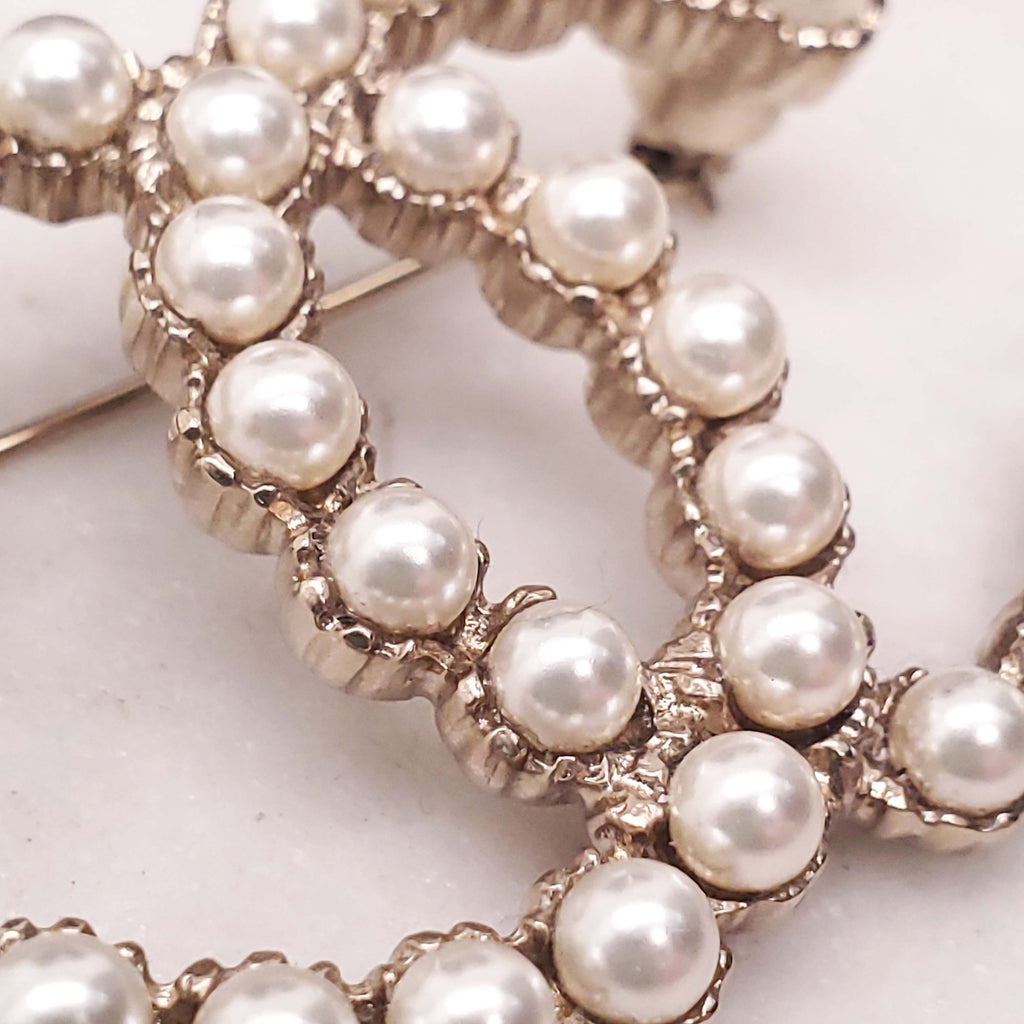 CHANEL PEARL LOGO BROOCH