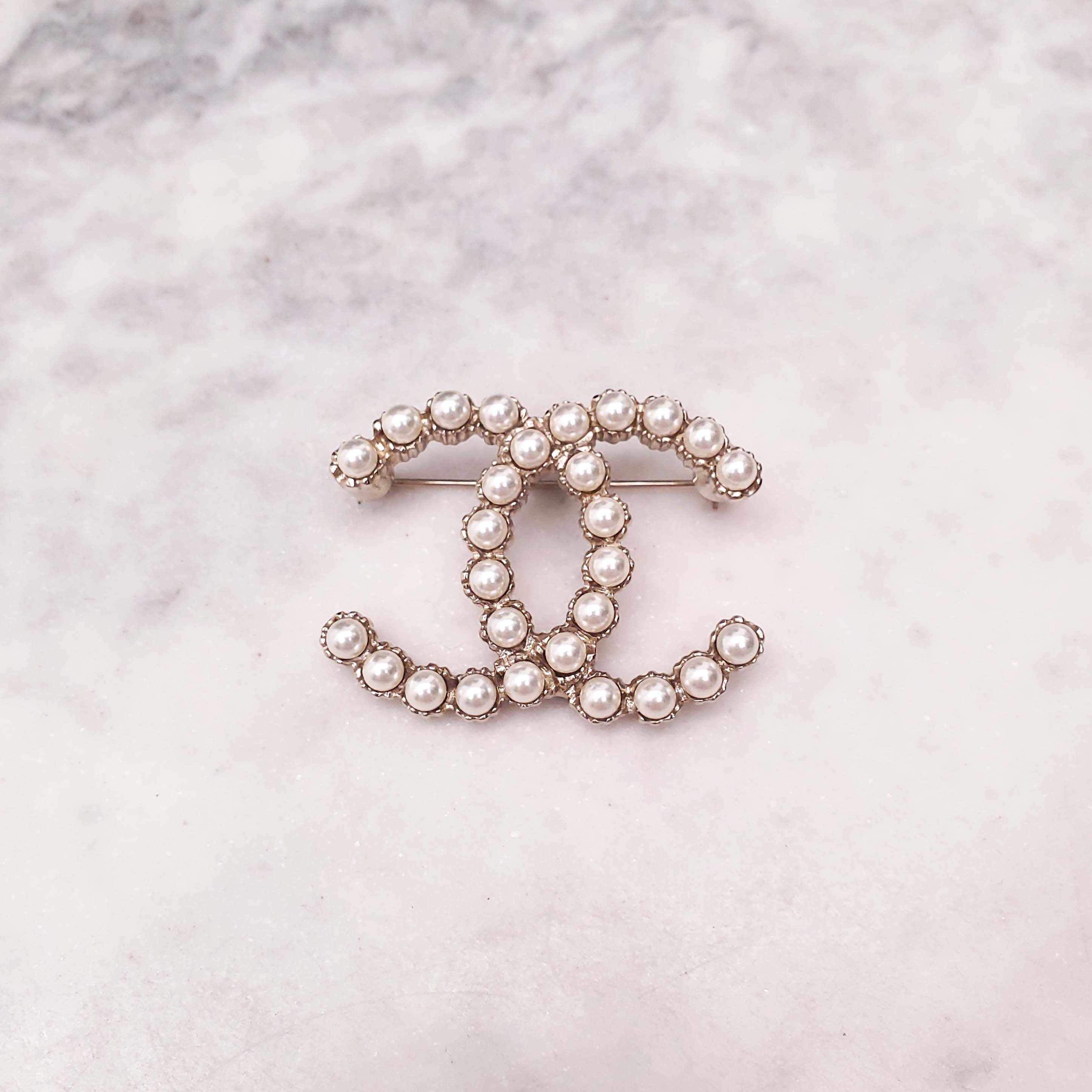 CHANEL PEARL LOGO BROOCH