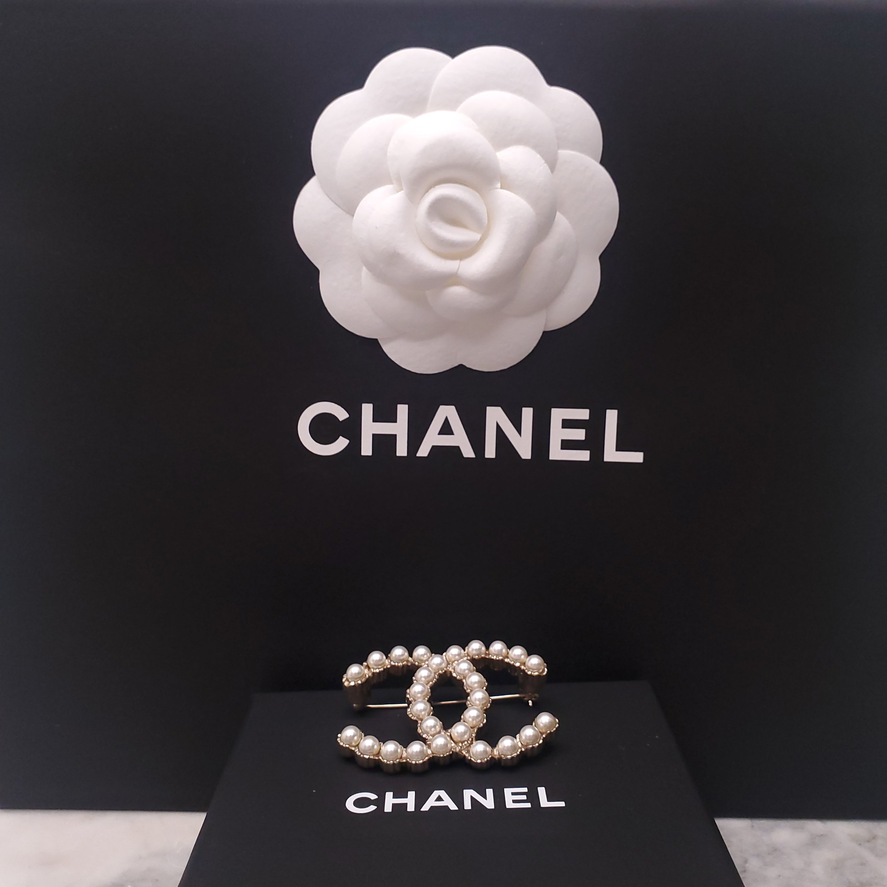 CHANEL PEARL LOGO BROOCH