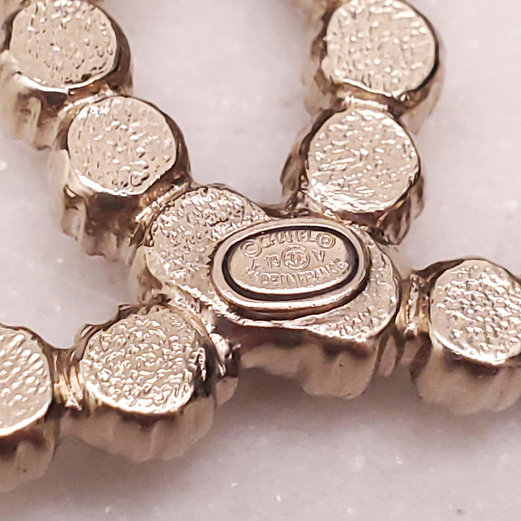 CHANEL PEARL LOGO BROOCH