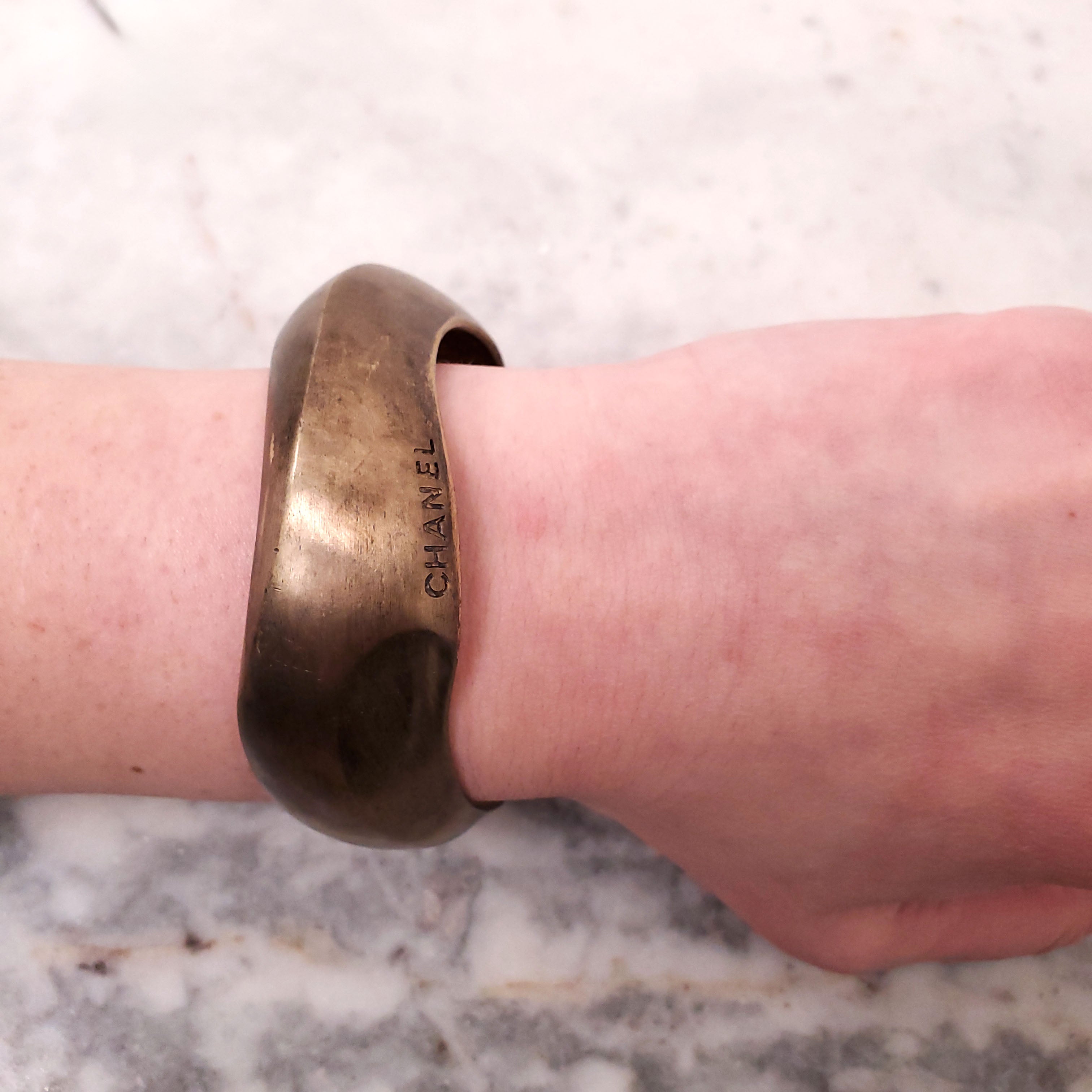 CHANEL VINTAGE BRONZE BANGLE WITH LOGO