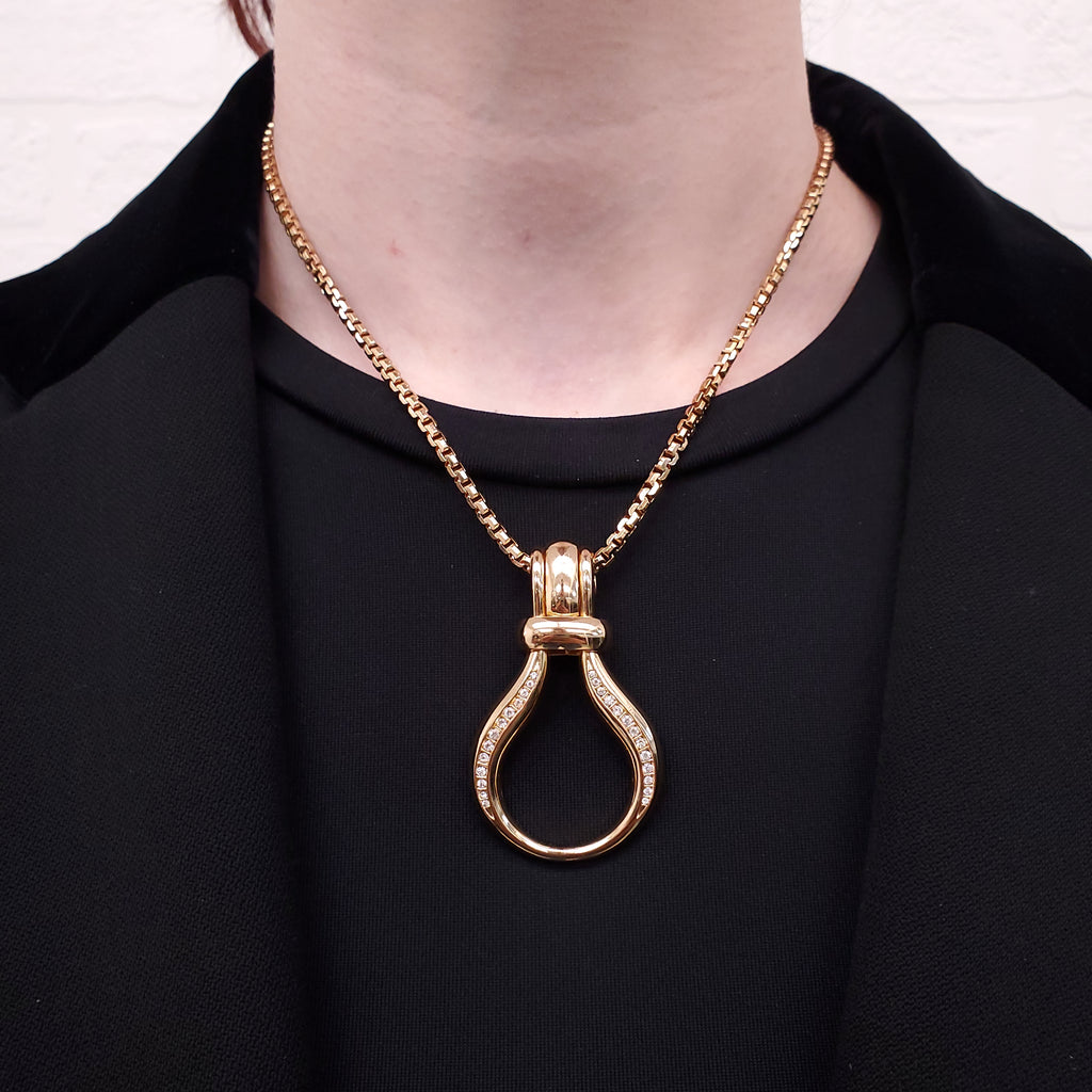 DIOR PENDANT GOLD NECKLACE WITH INTERLOCKING HOOPS ON GOLD CHAIN
