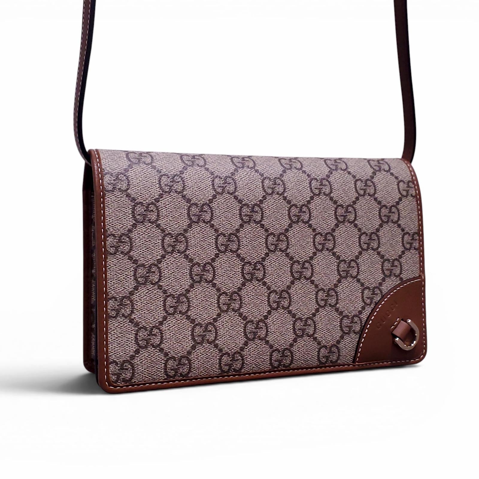 GUCCI GG EMBLEM WALLET WITH LEATHER STRAP