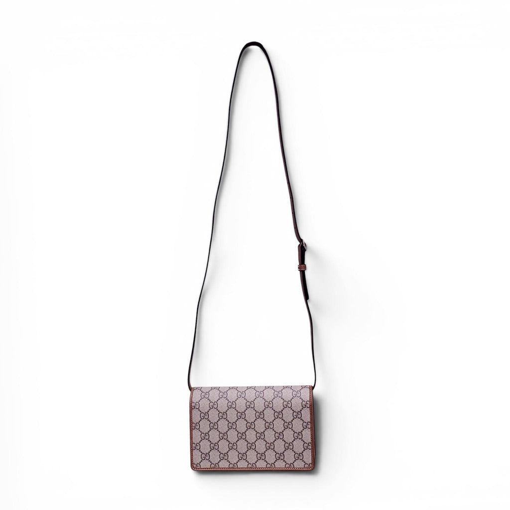 GUCCI GG EMBLEM WALLET WITH LEATHER STRAP