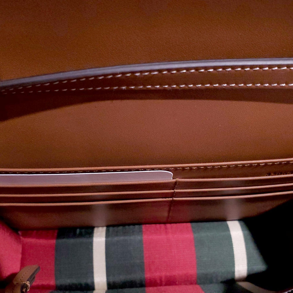GUCCI GG EMBLEM WALLET WITH LEATHER STRAP