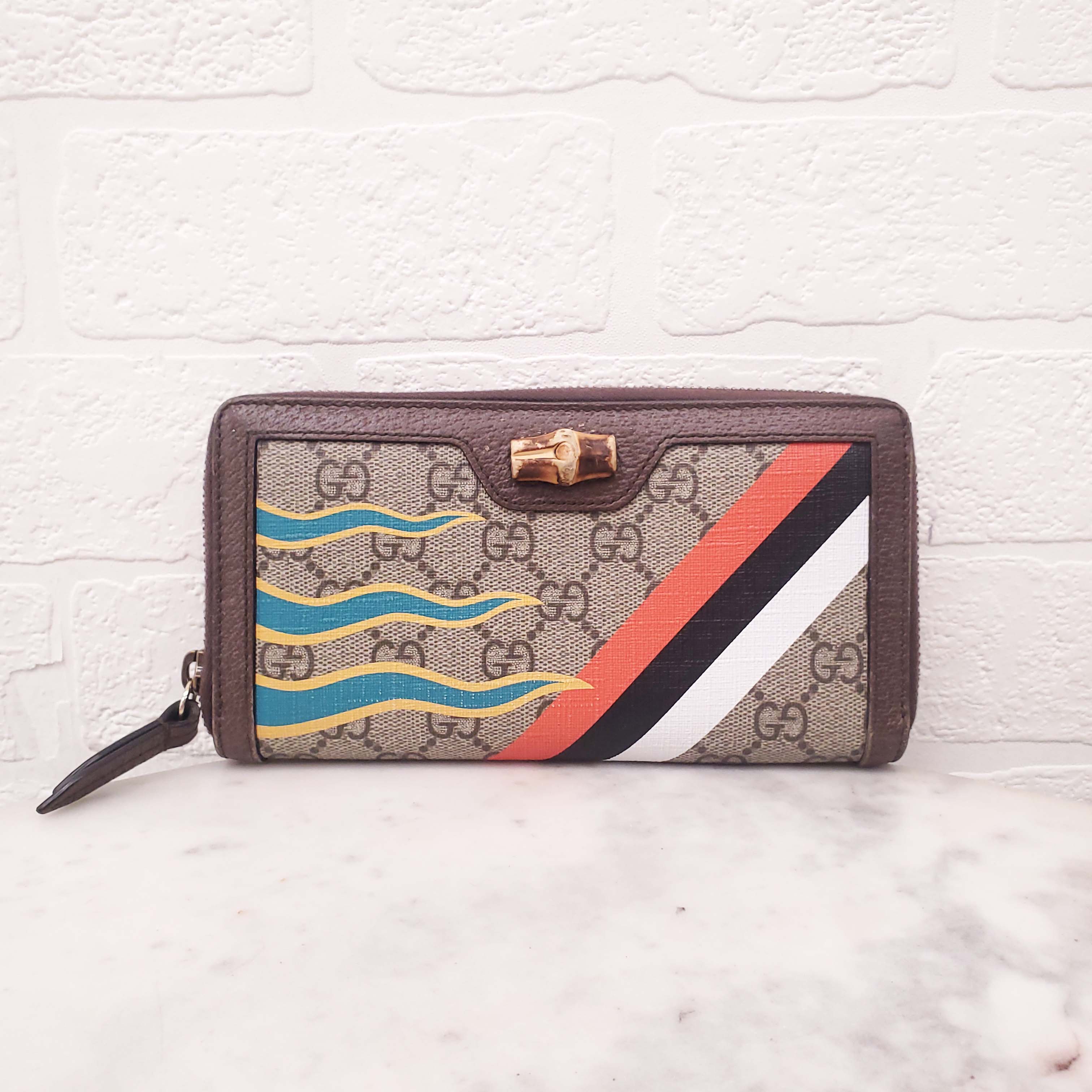 GUCCI MONOGRAM ZIP AROUND WALLET WITH BAMBOO DETAIL