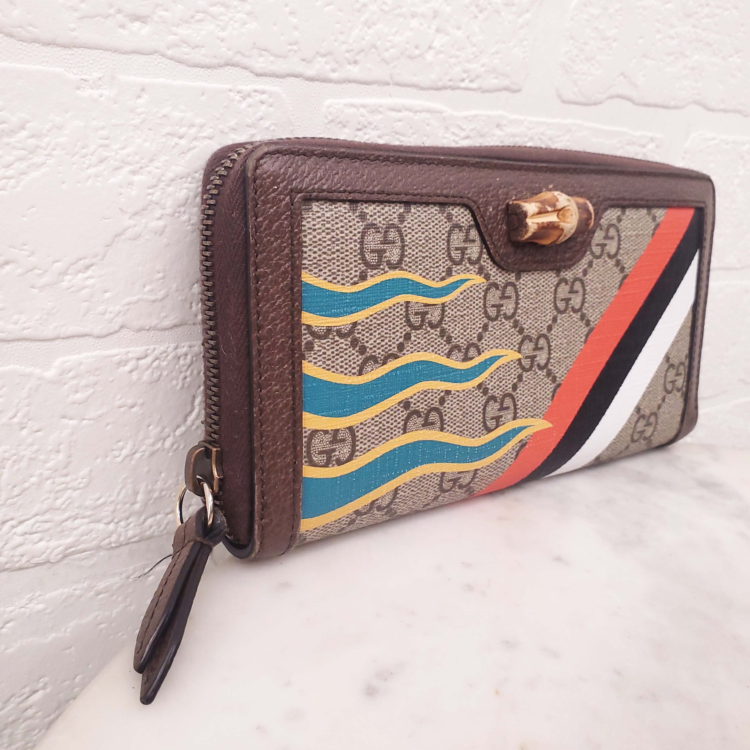 GUCCI MONOGRAM ZIP AROUND WALLET WITH BAMBOO DETAIL