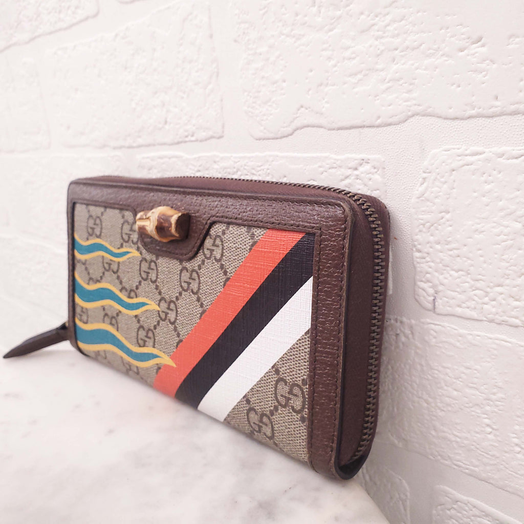 GUCCI MONOGRAM ZIP AROUND WALLET WITH BAMBOO DETAIL