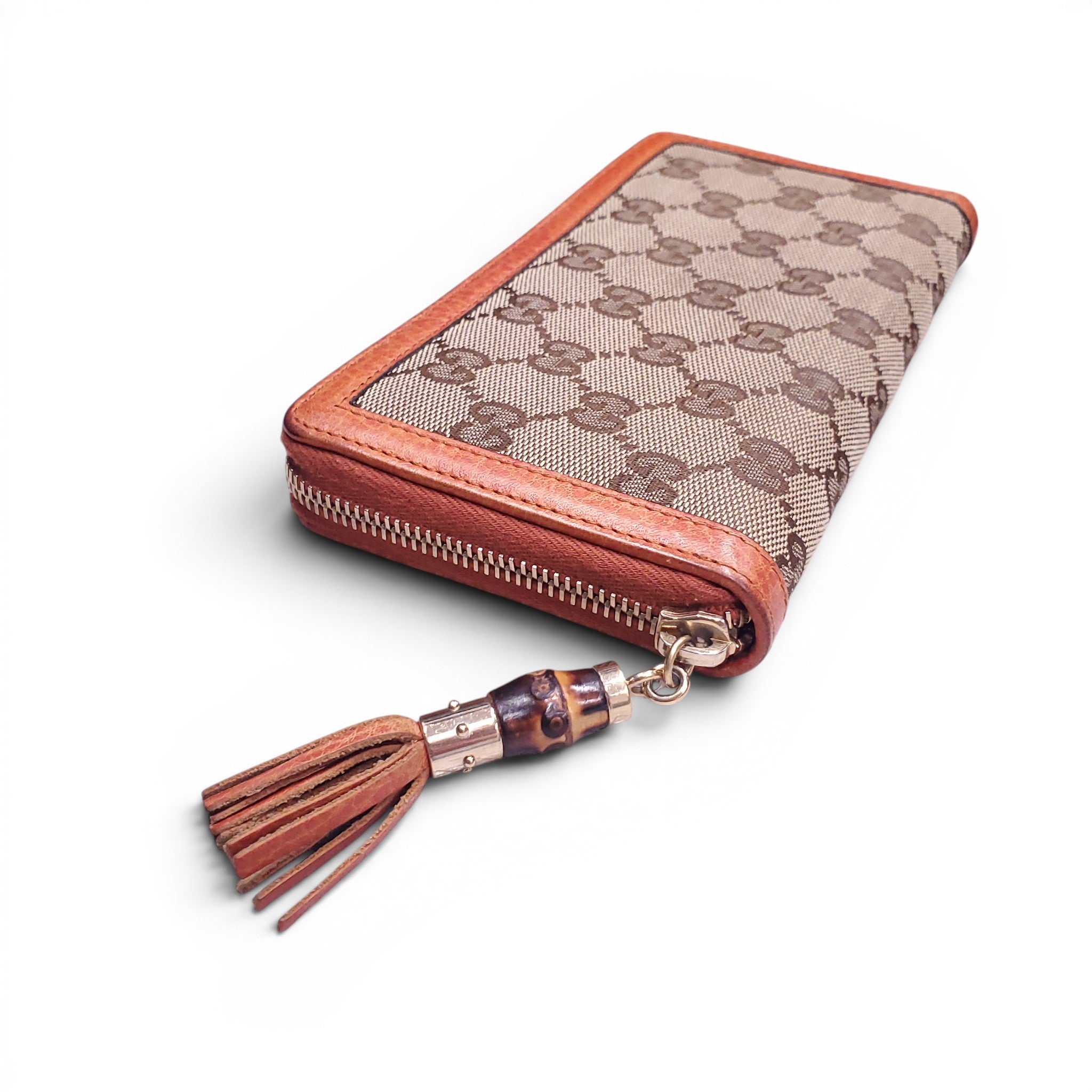 GUCCI MONOGRAM ZIP AROUND WALLET WITH BAMBOO TASSEL DETAIL