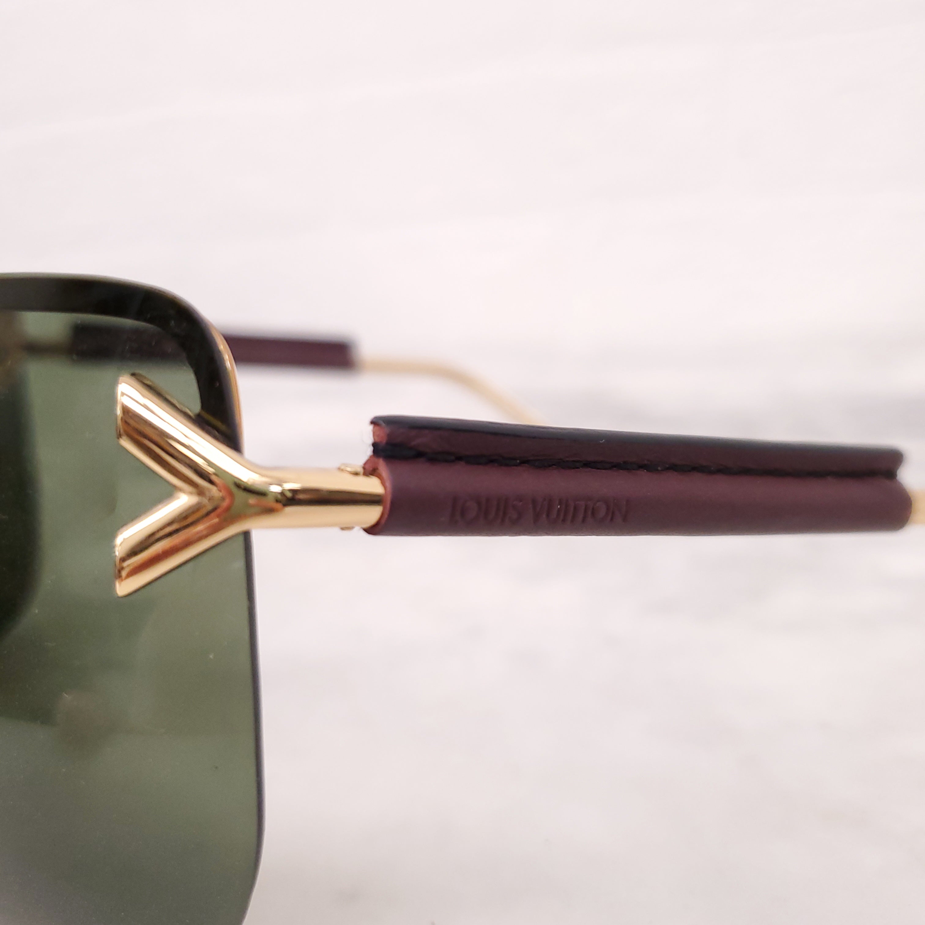 LOUIS VUITTON MASK LOGO SUNGLASSES WITH LEATHER DETAIL