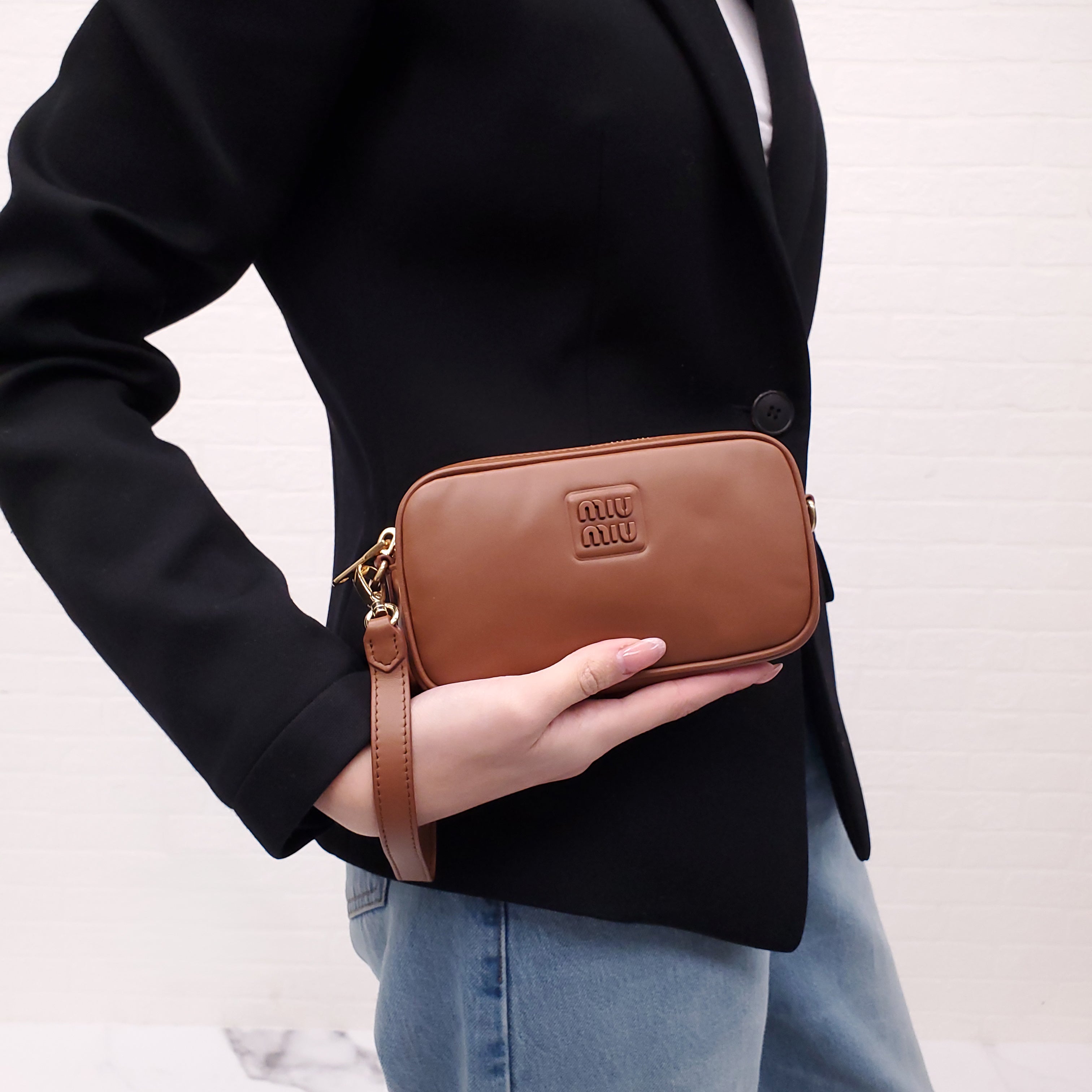 MIU MIU BROWN WRISTLET BAG WITH EMBOSSED LOGO