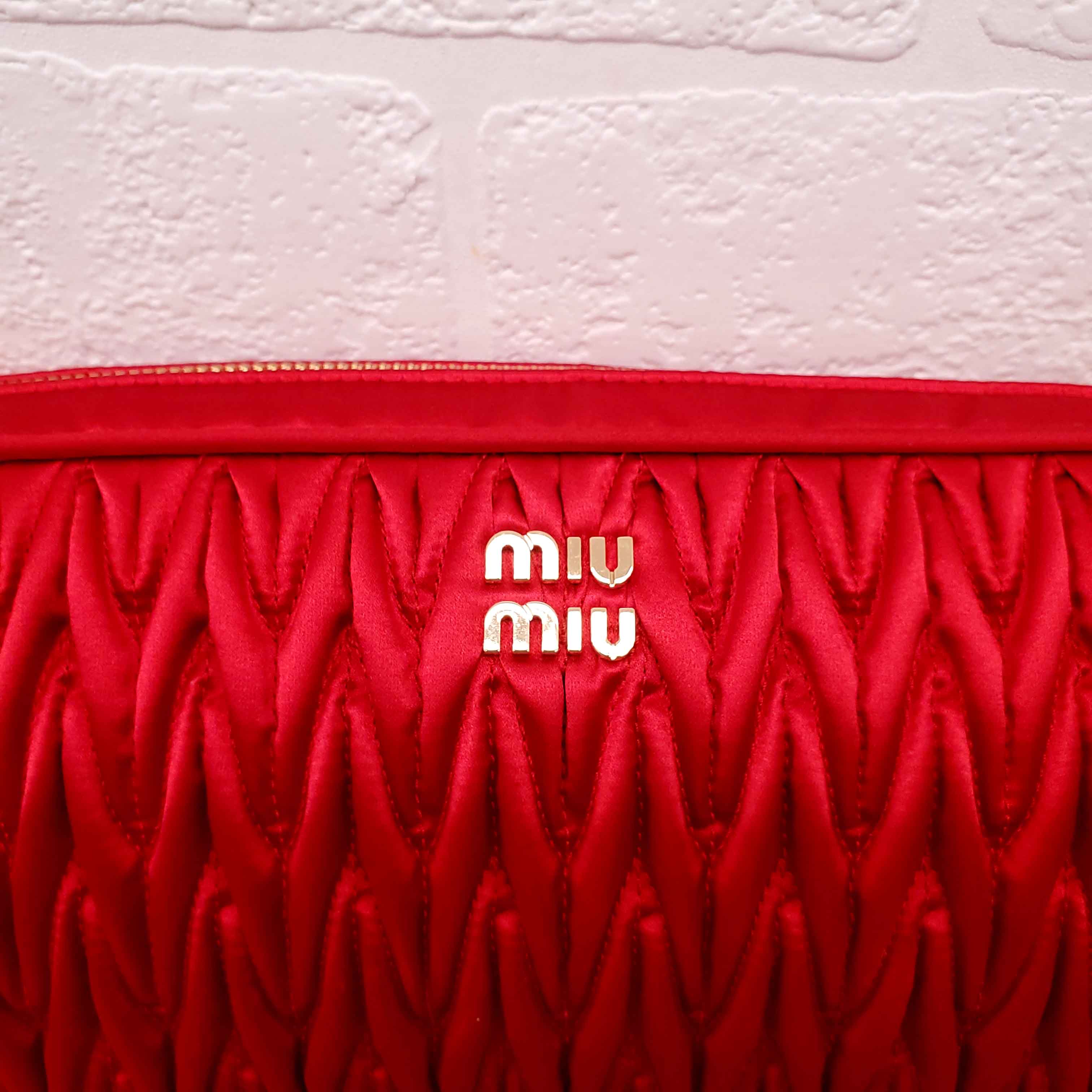 MIU MIU RED WOVEN TRAVEL BAG