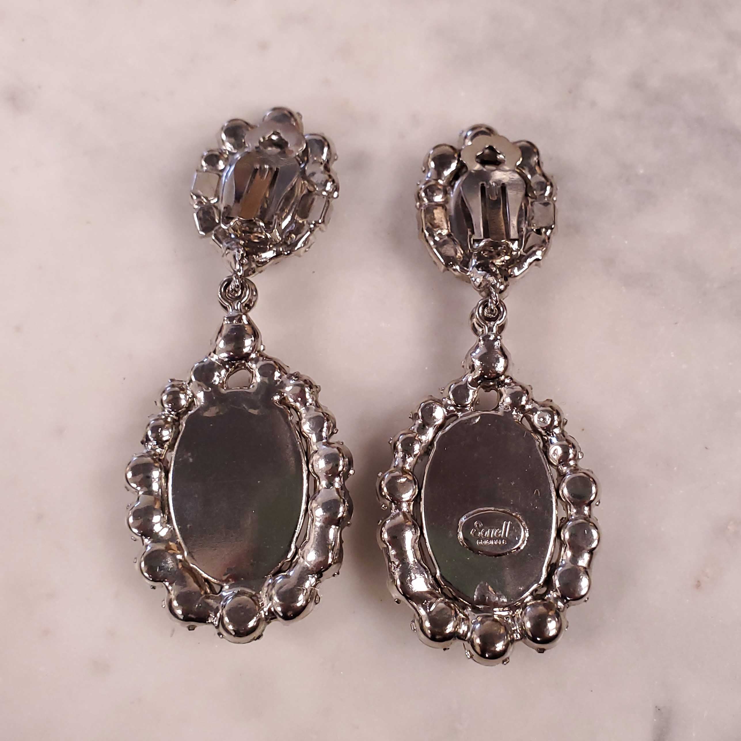 ROBERT SORRELL DIAMOND AND AMETHYST-COLOURED DANGLE RHINESTONE EARRINGS