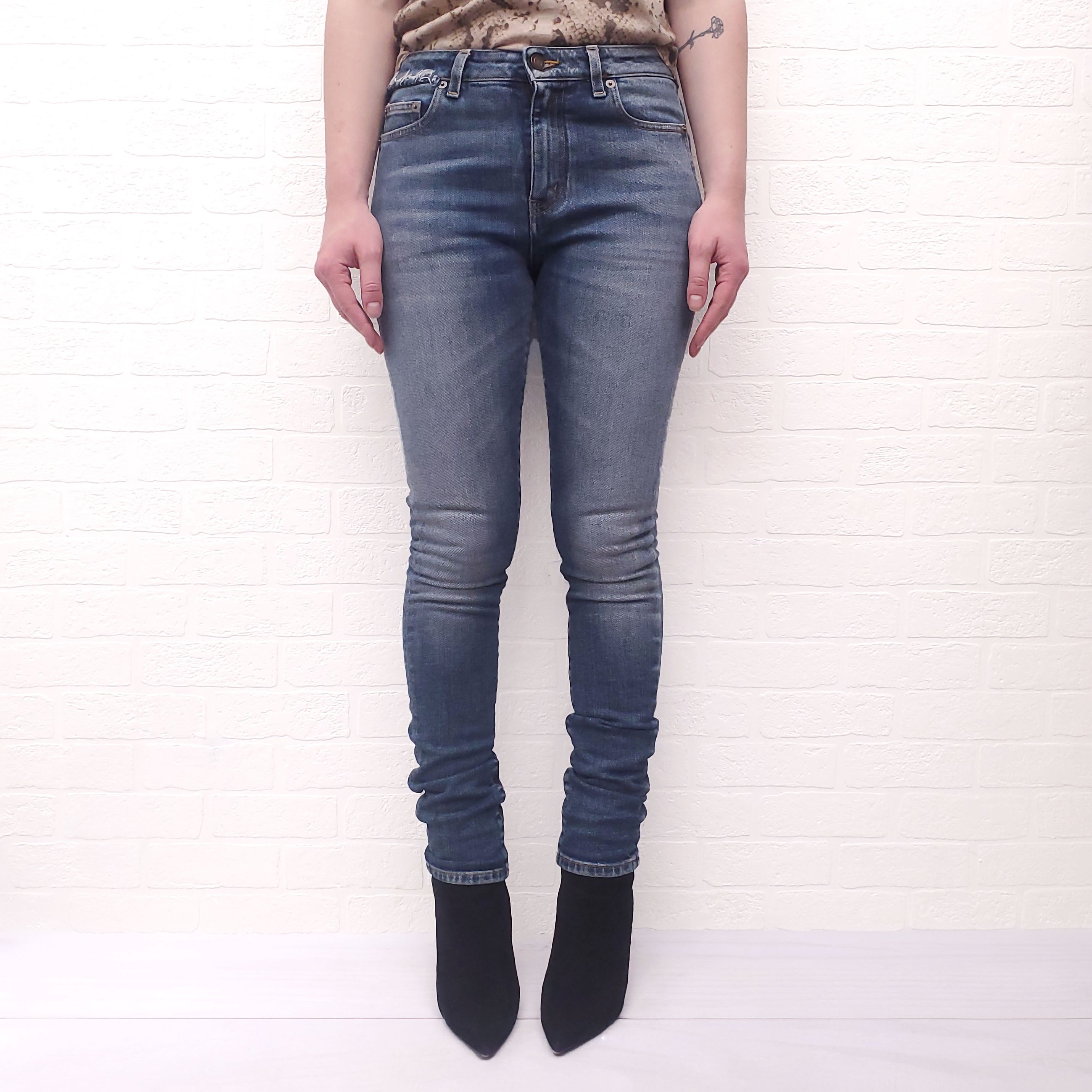 SAINT LAURENT SKINNY JEANS WITH DISTRESSED SIDE DETAIL - SIZE 25