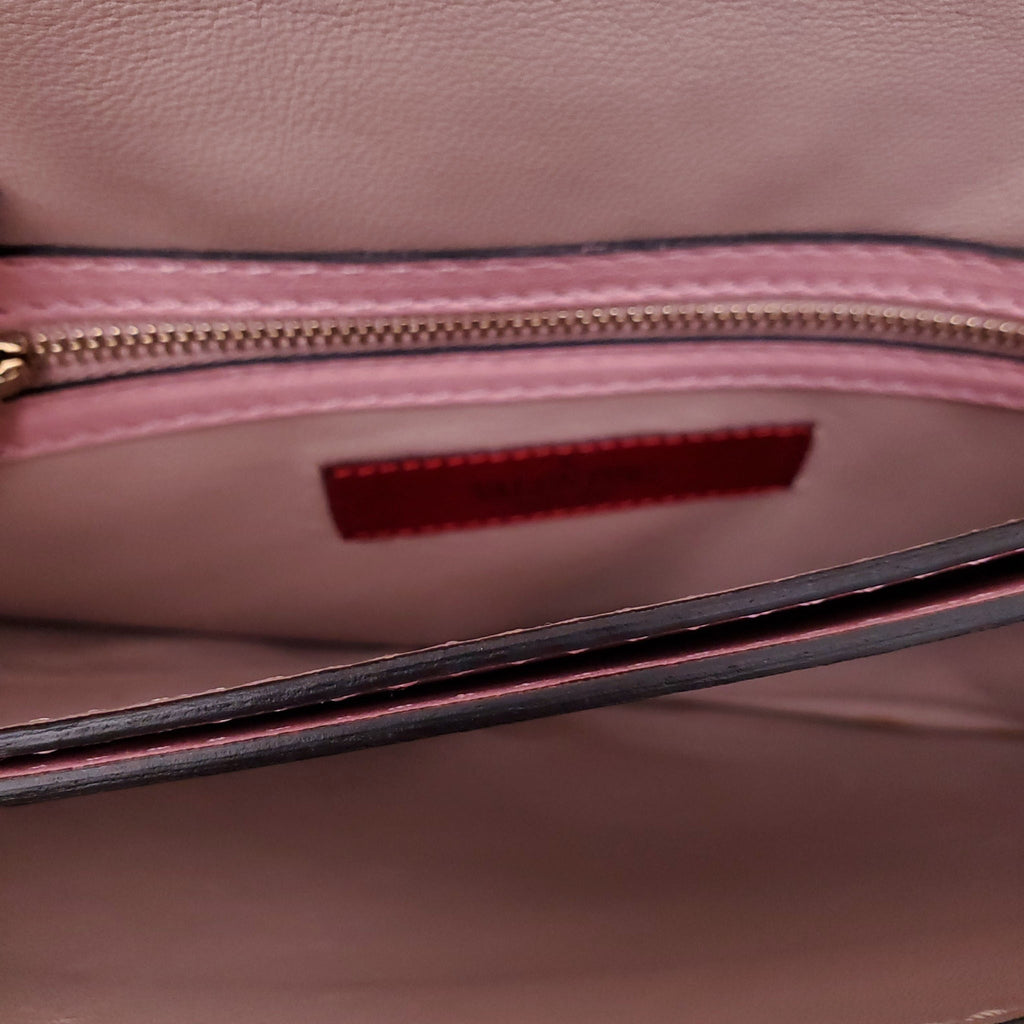 VALENTINIO PINK ROCKSTUD WRISTLET CLUTCH