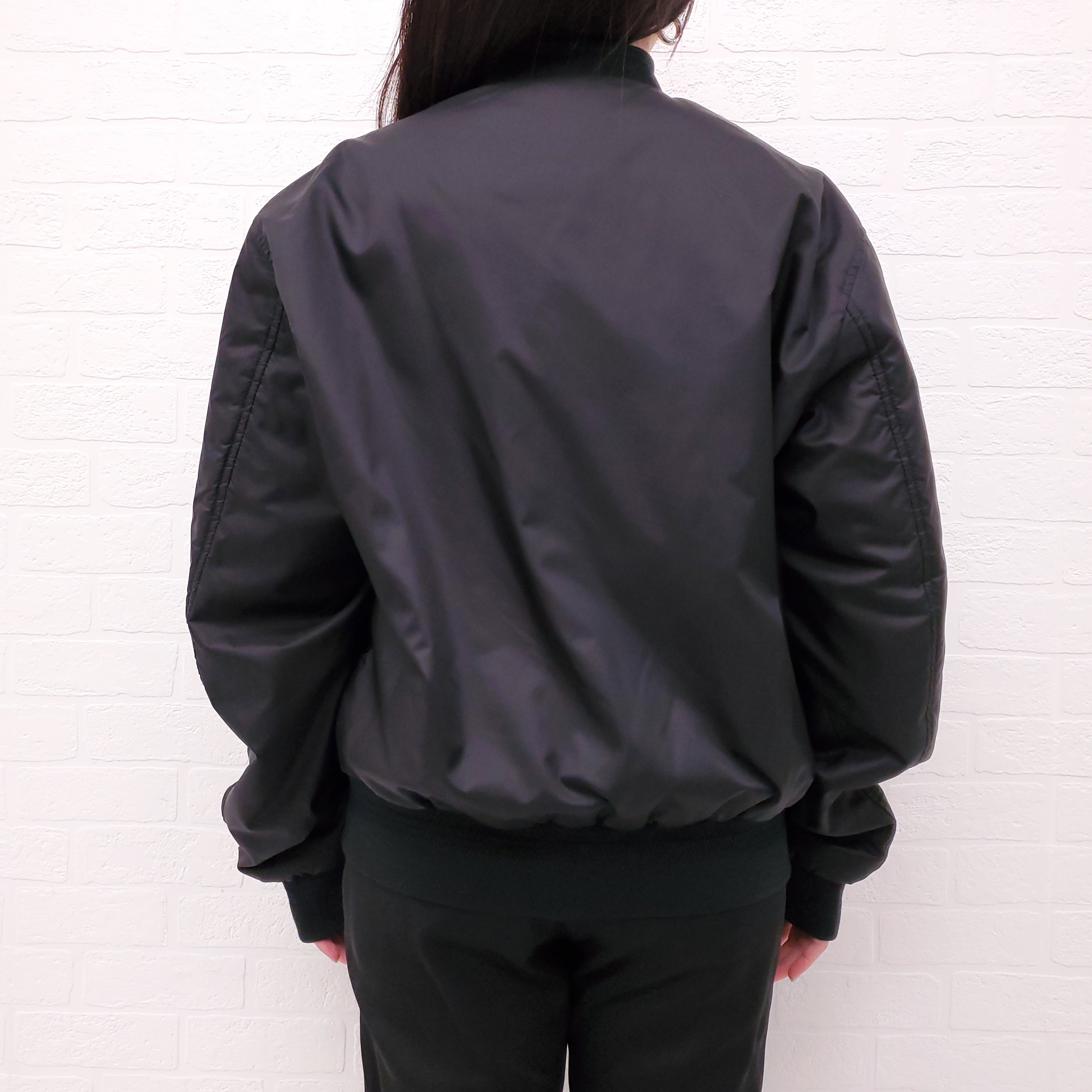 VERSACE BLACK REVERSIBLE BOMBER JACKET WITH SUNGLASSES DETAIL - SIZE 50