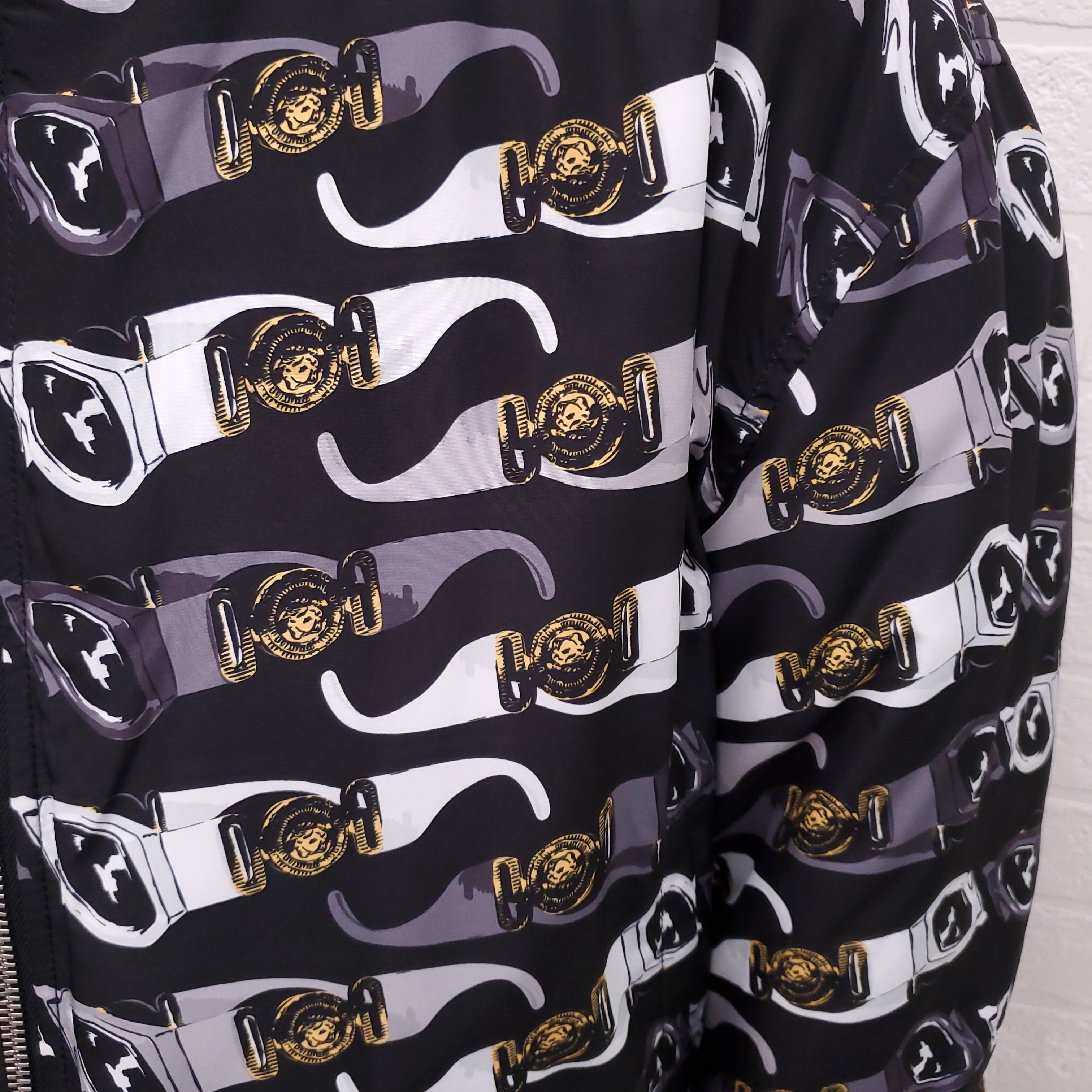 VERSACE BLACK REVERSIBLE BOMBER JACKET WITH SUNGLASSES DETAIL - SIZE 50