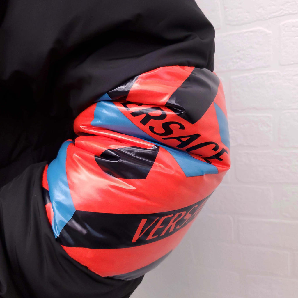 VERSACE BLACK, RED AND BLUE PATTERNED LOGO PUFFER JACKET WITH MEDUSA BUTTONS - SIZE 42