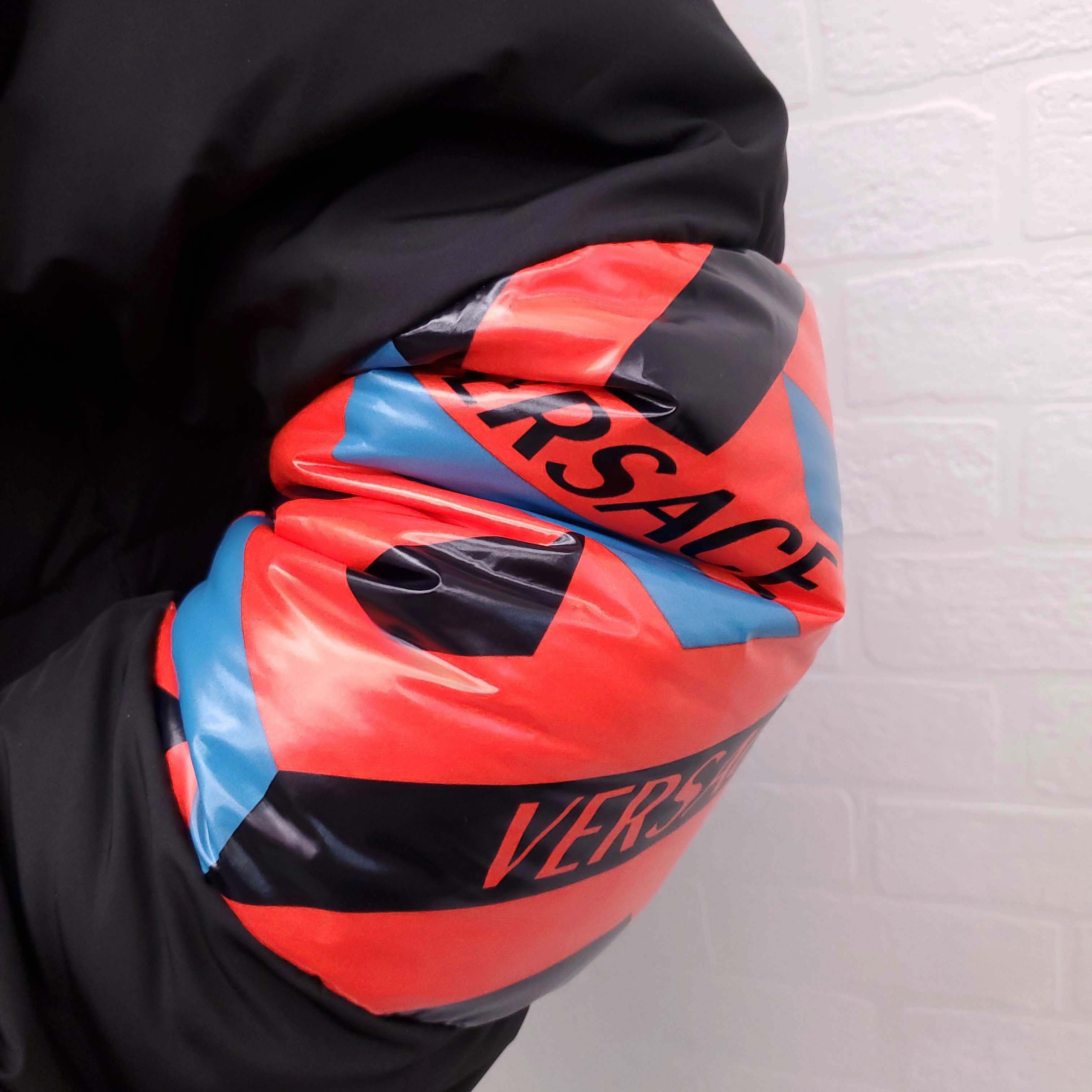 VERSACE BLACK, RED AND BLUE PATTERNED LOGO PUFFER JACKET WITH MEDUSA BUTTONS - SIZE 42