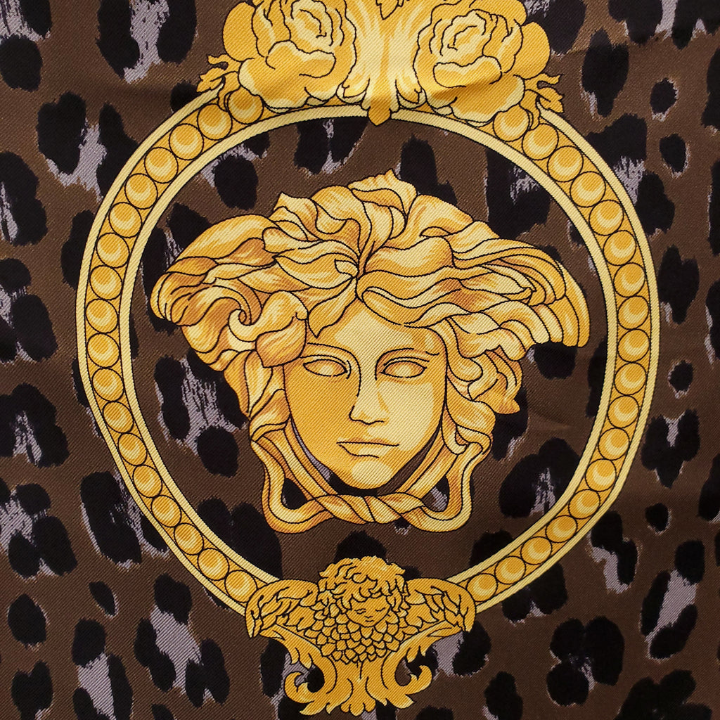 VERSACE GOLD AND BROWN SCARF WITH ANIMAL PRINT DETAIL