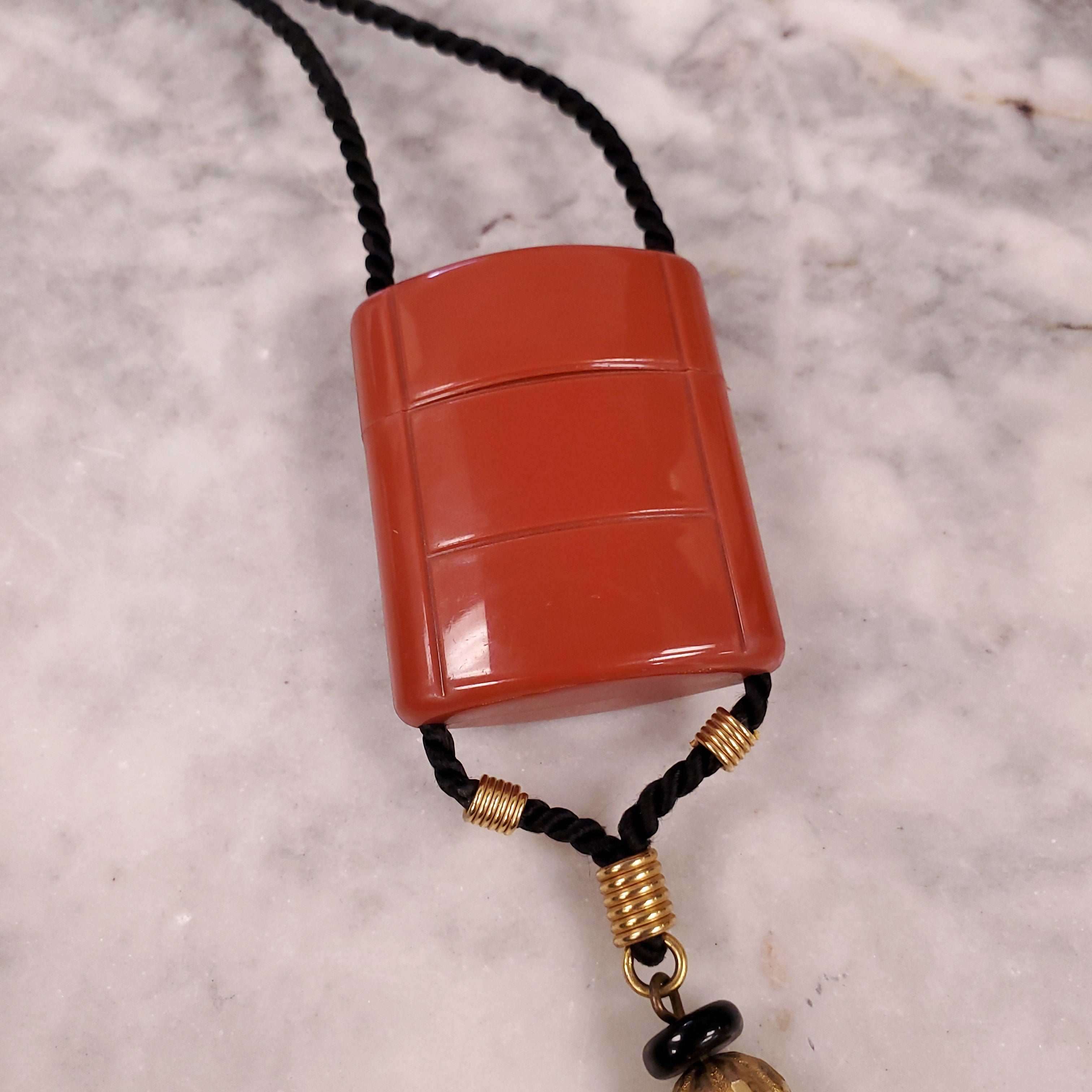 YVES SAINT LAURENT 1970 PLASTIC PENDANT NECKLACE WITH TASSEL ON ROPE